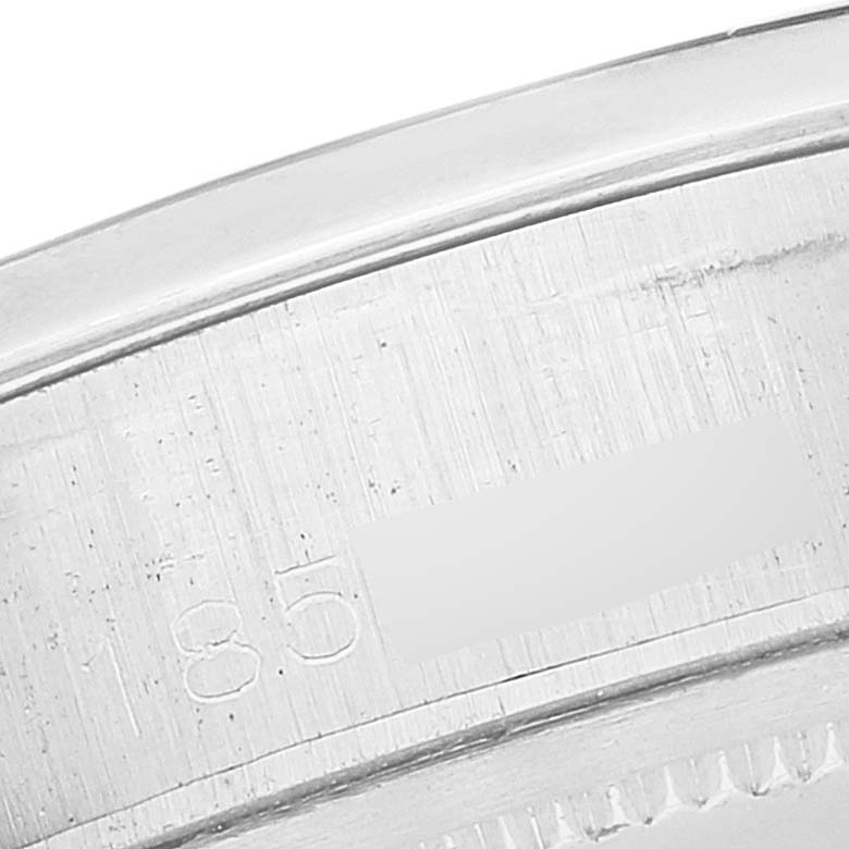 This image shows a close-up of a portion of the bezel and serial number on the Rolex Vintage Collection 6694 Men's Stainless Steel Black Dial 6694 Men's Stainless Steel Black Dial watch.