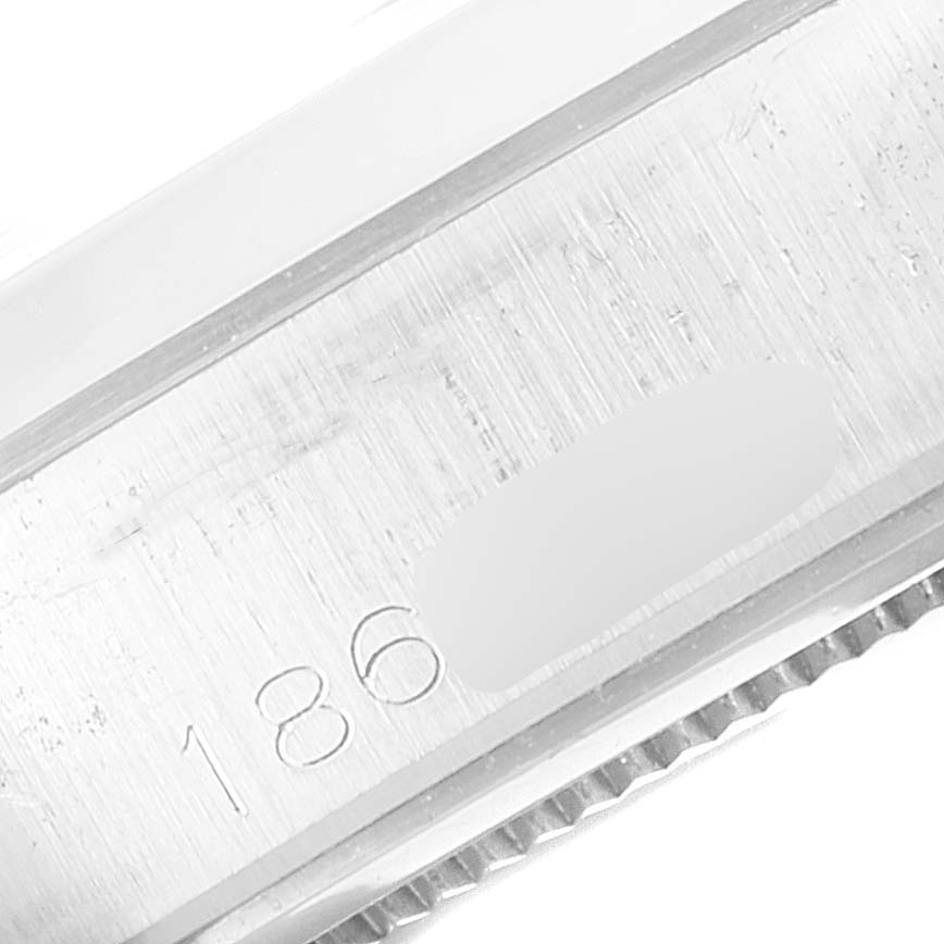 This close-up image shows the serial number engraved on the side of the case of the Rolex Vintage Collection 6694 Men's Stainless Steel Silver Dial 6694 Men's Stainless Steel Silver Dial watch.