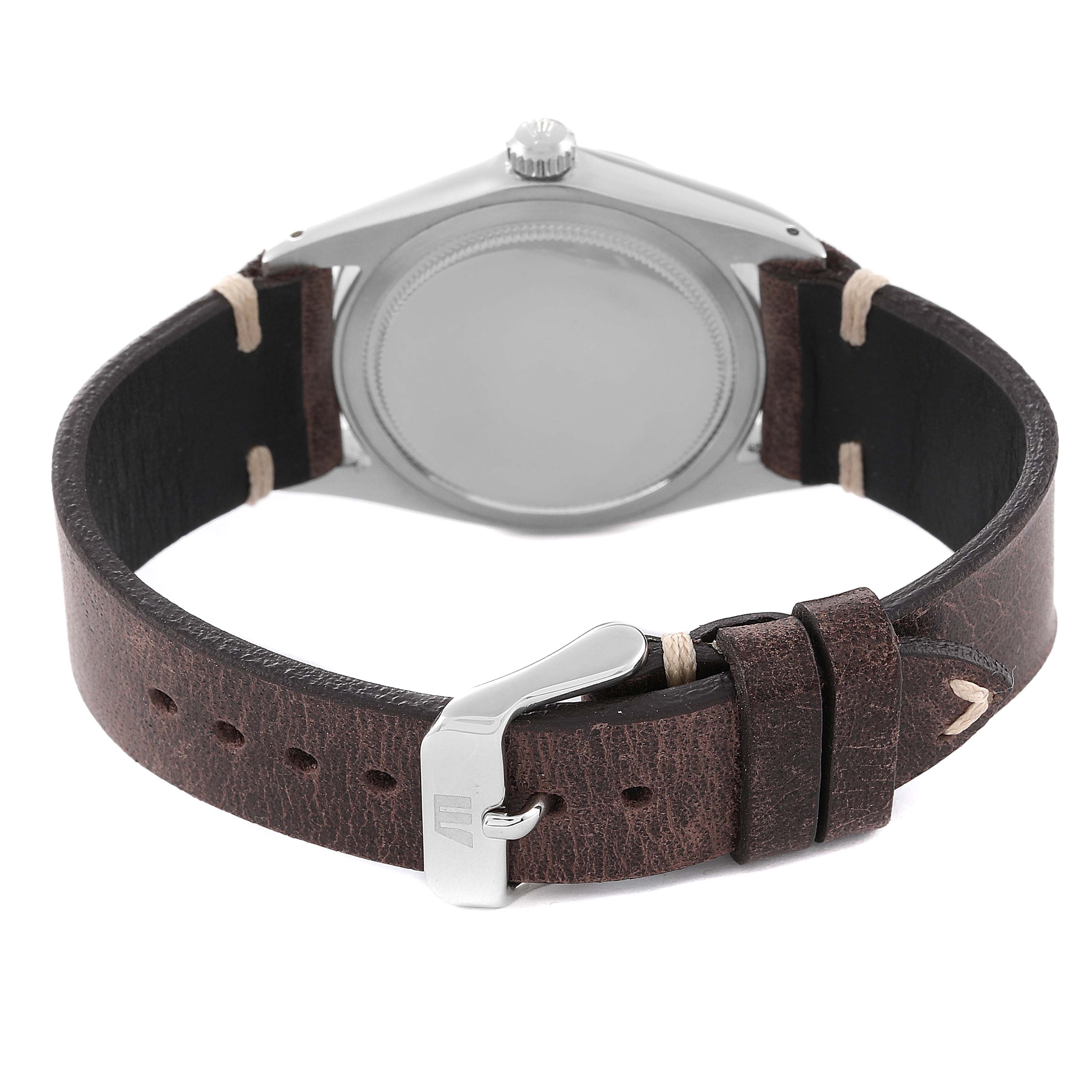 The image shows the back view of a Rolex Date 6694 Men's Stainless Steel Silver Dial 6694 Men's Stainless Steel Silver Dial watch, highlighting the case and brown leather strap with a buckle.