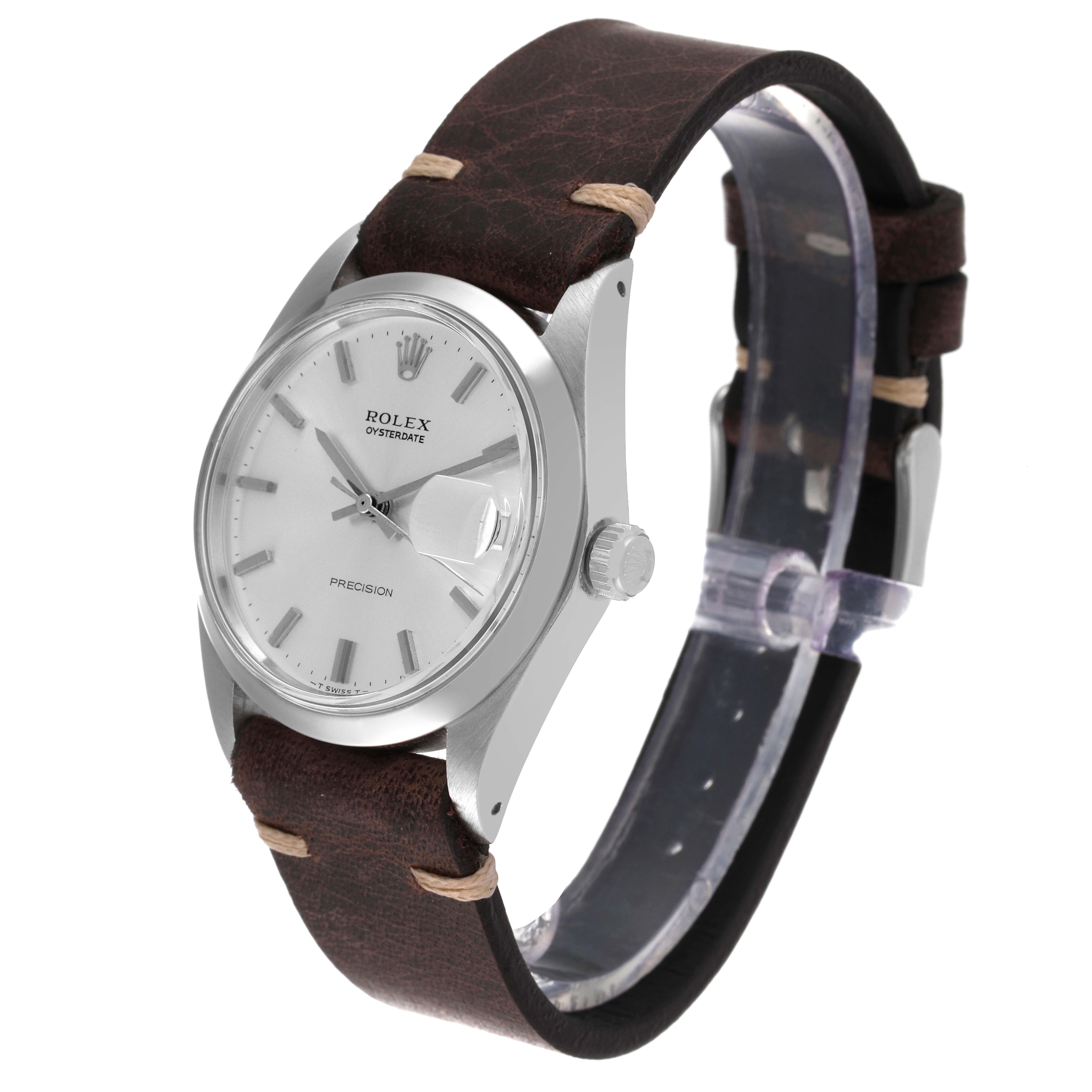 This image shows a side angle of a Rolex Date 6694 Men's Stainless Steel Silver Dial 6694 Men's Stainless Steel Silver Dial watch, highlighting its face, crown, and brown leather strap.