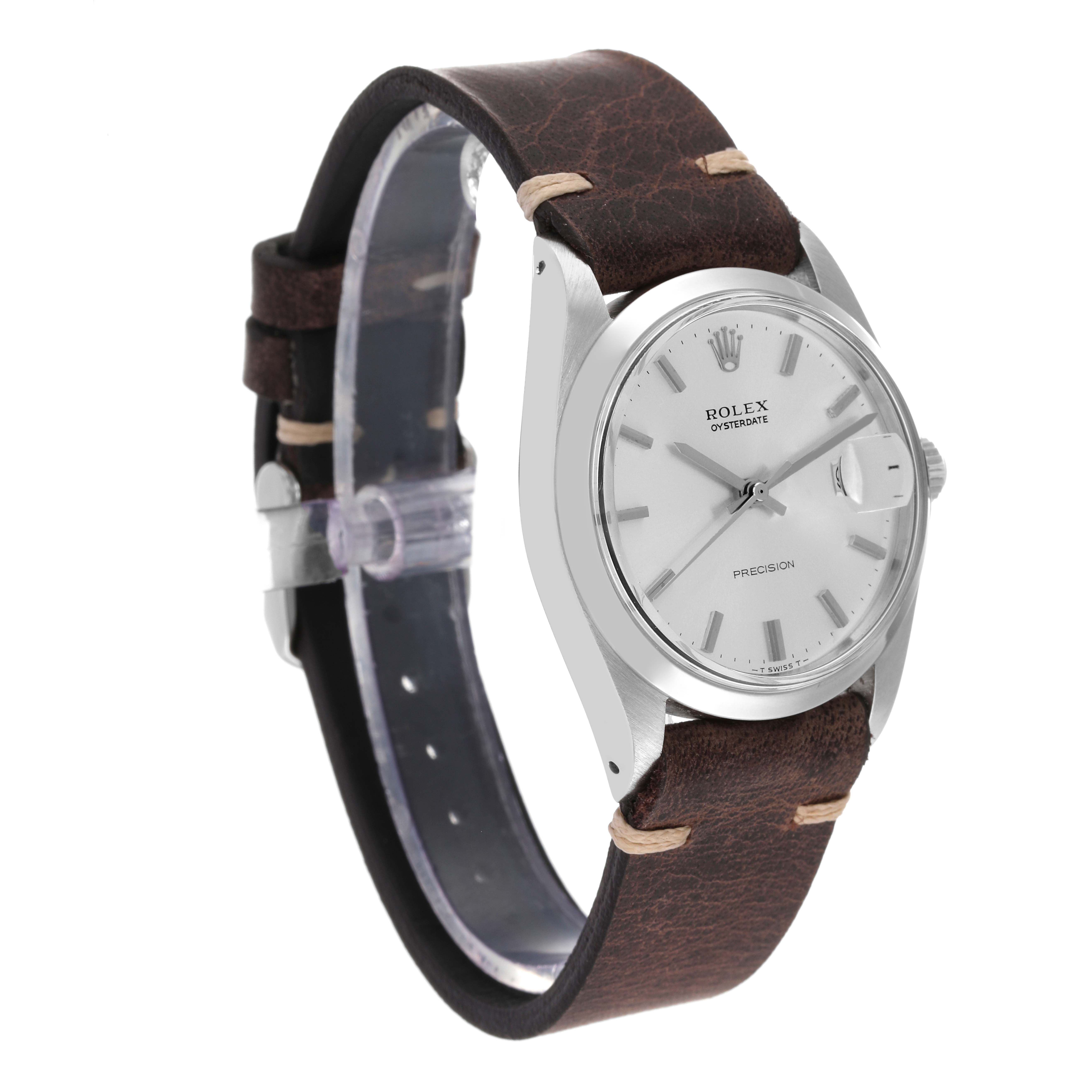 The image shows a side view of a Rolex Date 6694 Men's Stainless Steel Silver Dial 6694 Men's Stainless Steel Silver Dial watch, featuring its dial, case, and leather strap.