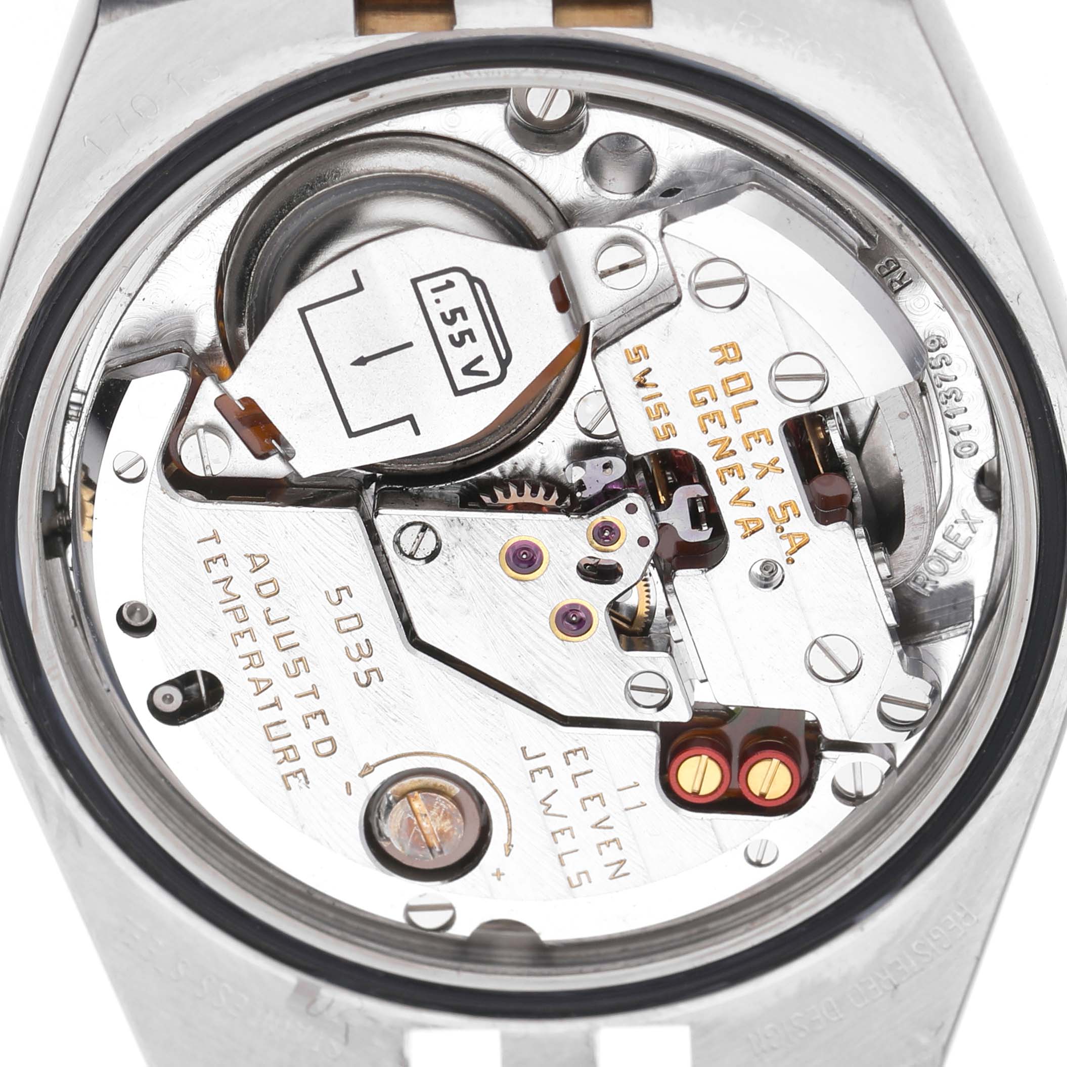 The image shows the interior movement components of a Rolex Oysterquartz 17013 Men's Steel and Gold (two tone) Champagne Dial watch from a top-down perspective.