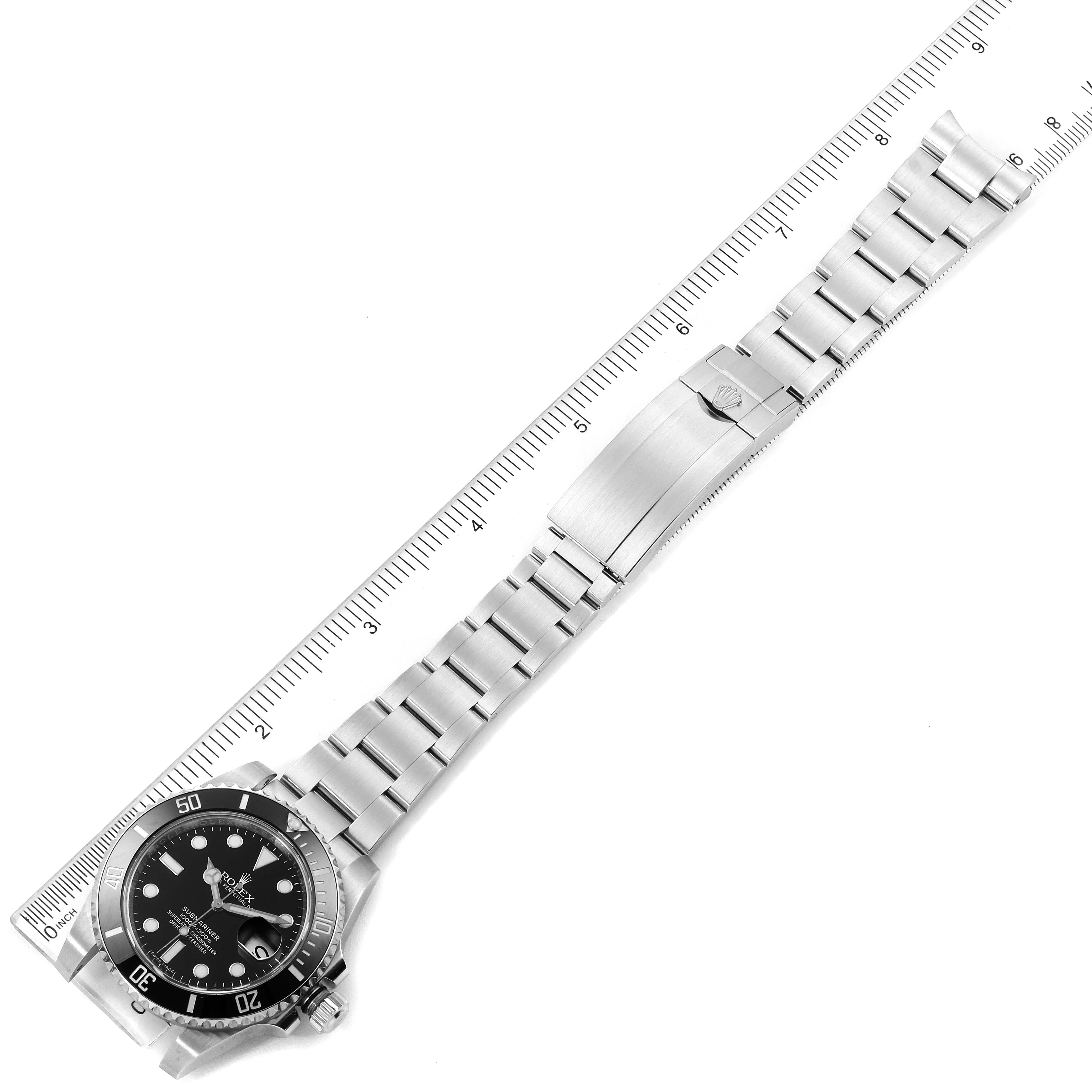 This image shows a Rolex Submariner 116610LN Men
s Stainless Steel Black Dial 116610LN Men
s Stainless Steel Black Dial watch from a top-down angle, featuring the full bracelet and partially the front face with bezel.