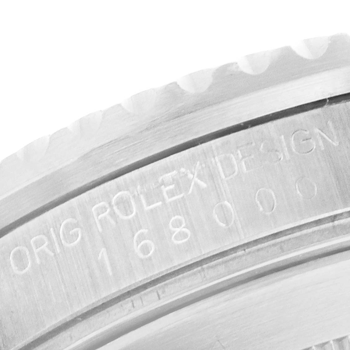 This image shows a close-up of the engraved case back of a Rolex Submariner 168000 Men's Stainless Steel Black Dial 168000 Men's Stainless Steel Black Dial watch.
