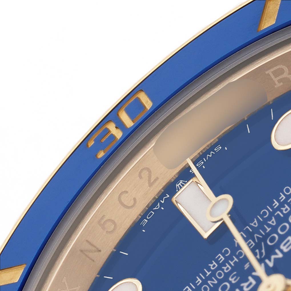 The image shows a close-up of the blue bezel and dial of a Rolex Submariner 126618LB Men's Yellow Gold Blue Dial, highlighting the "30" minute mark.