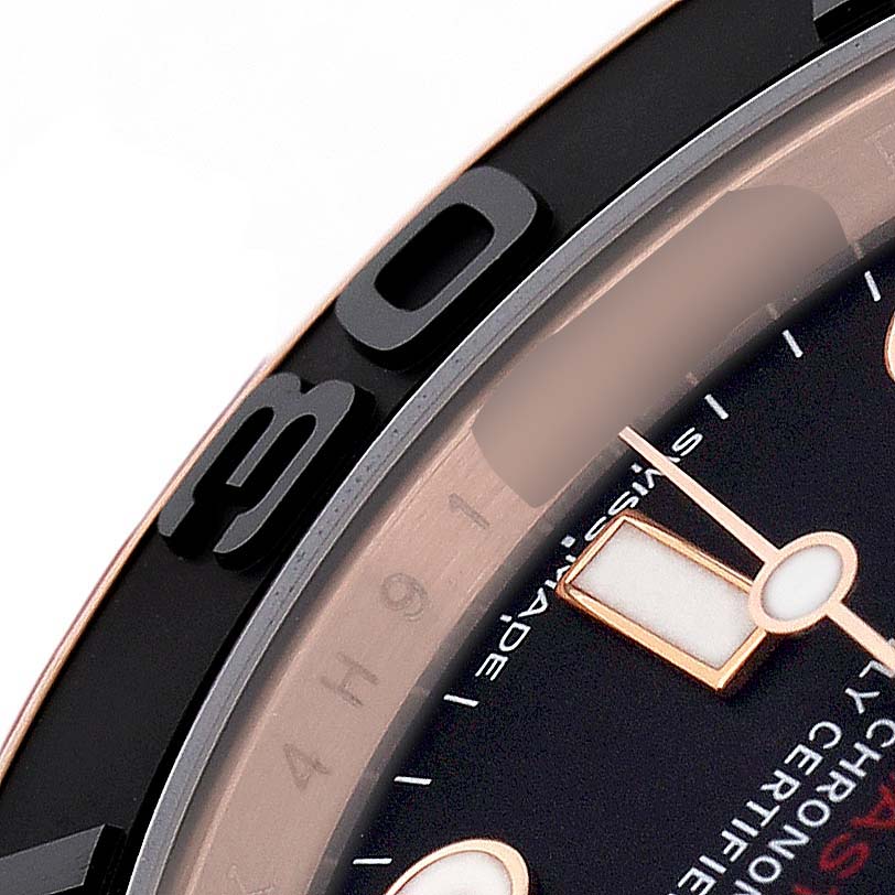 The image shows a close-up of the bezel and part of the dial of a Rolex Yacht-Master 116655 Men's Rose Gold Black Dial watch.