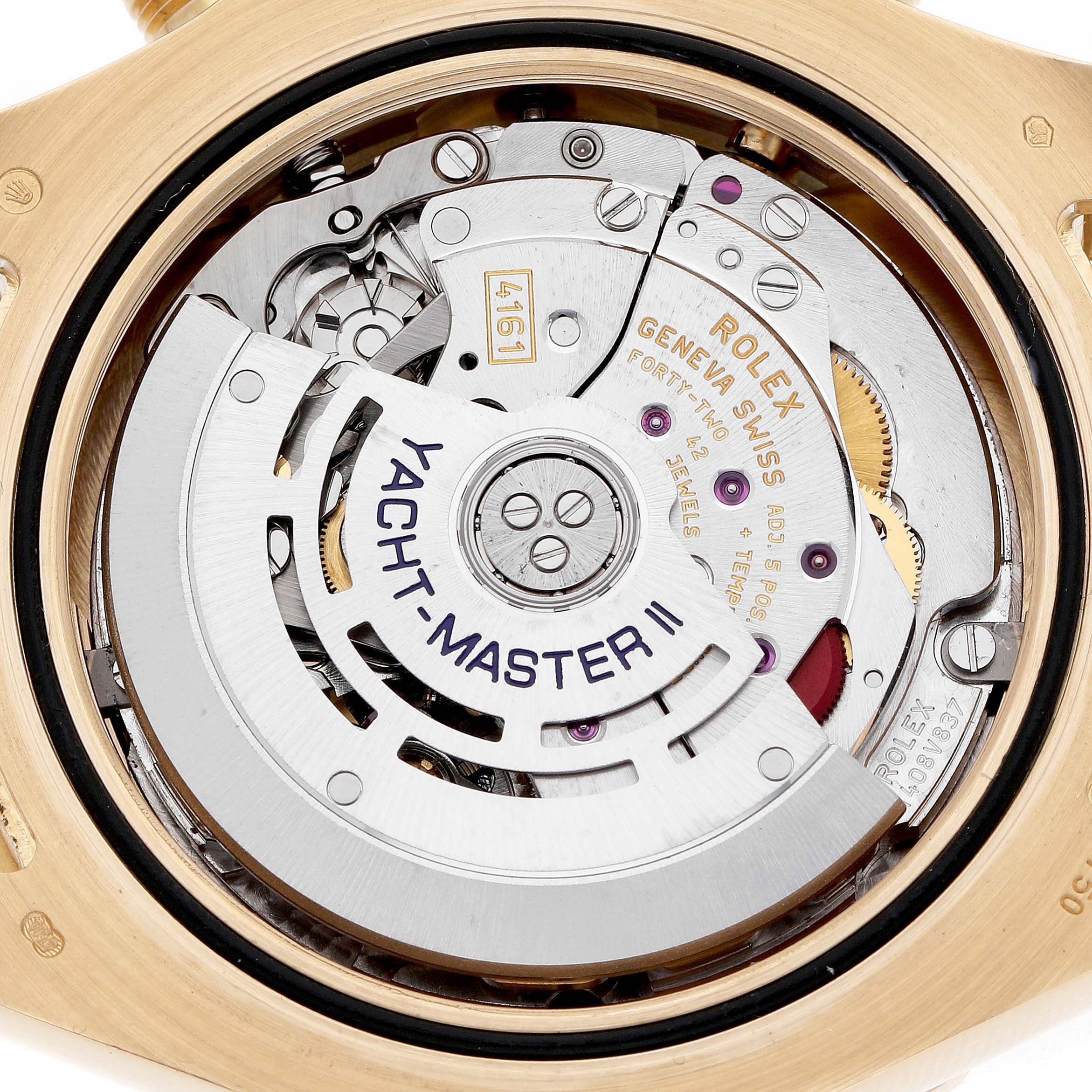 The image shows the movement of a Rolex Yacht-Master 116688M Men's Yellow Gold White Dial II from the back, highlighting the rotor and internal mechanisms.