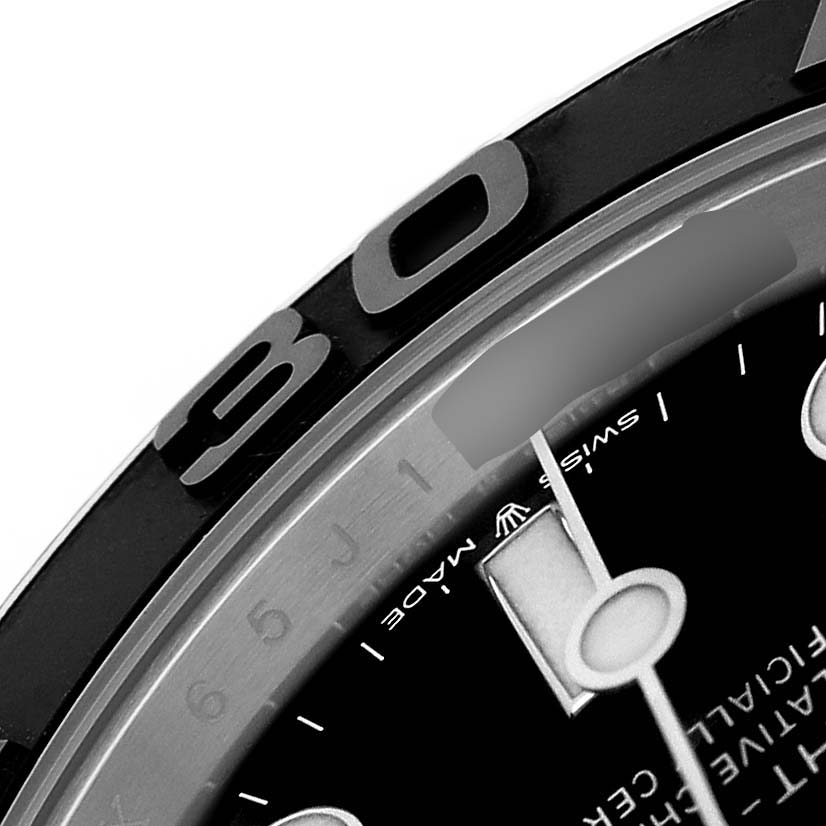 The image shows a close-up of the bezel, dial, and part of the minute hand of the Rolex Yacht-Master 226659 Men's White Gold Black Dial watch.