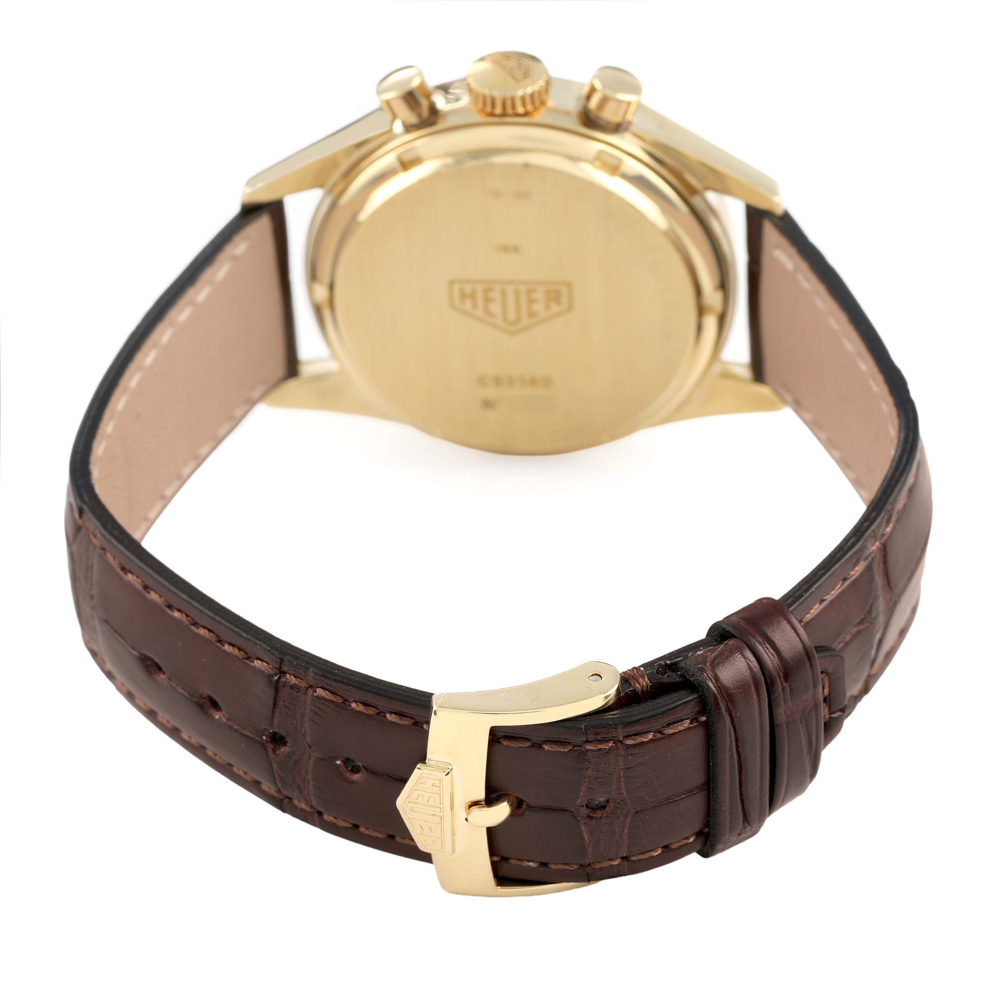 The image shows a rear view of the Tag Heuer Carrera CS3140 Men's Yellow Gold Silver Dial, highlighting the gold case back, crown, and brown leather strap with a buckle.