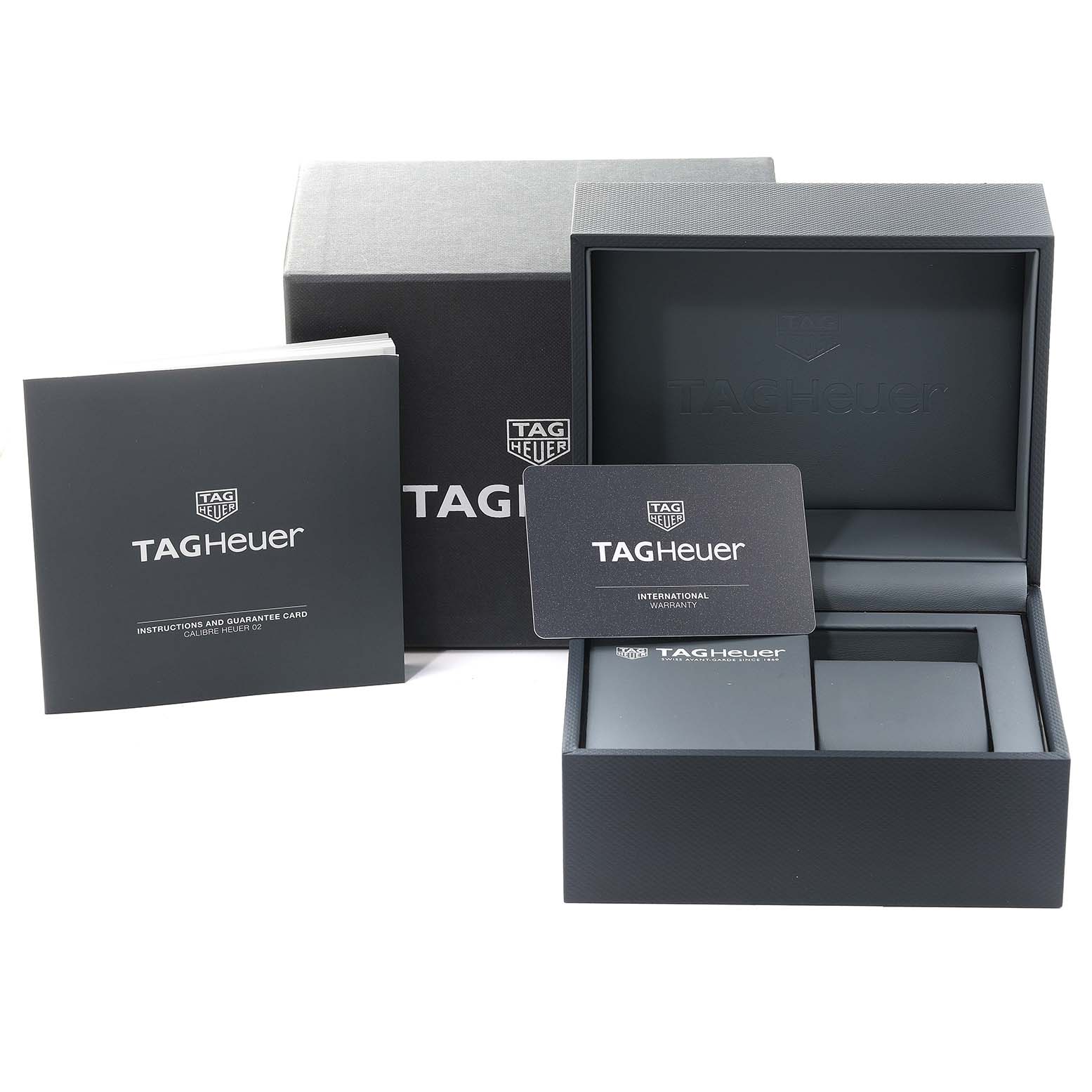 This image shows the Tag Heuer Carrera CBG2A91.FT6173 Men's Ceramic Black Dial CBG2A91.FT6173 Men's Ceramic Black Dial watch box, an instruction manual, and an international warranty card.