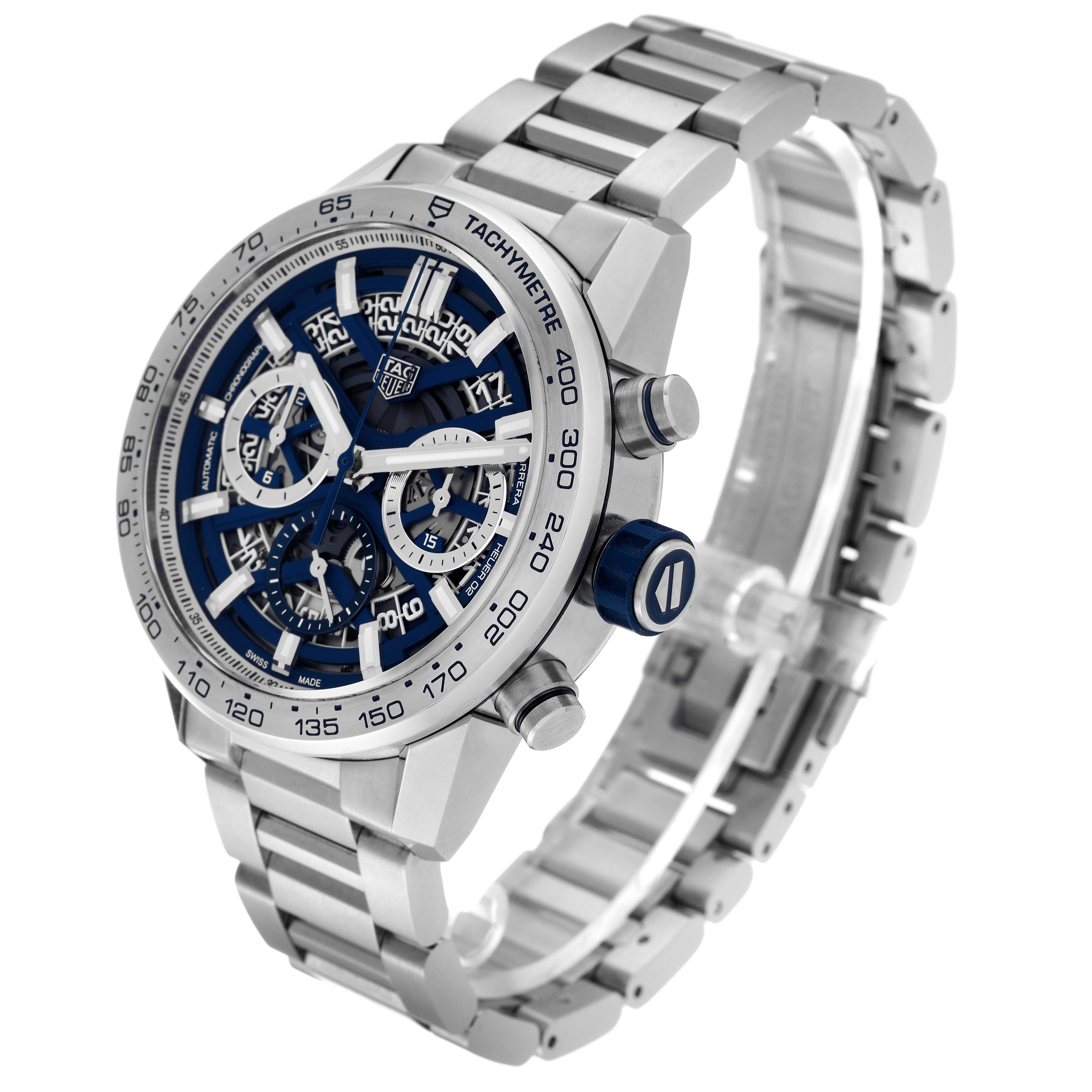 The image shows a Tag Heuer Carrera model watch from a front-right angle, highlighting its dial, bezel, and metal bracelet.