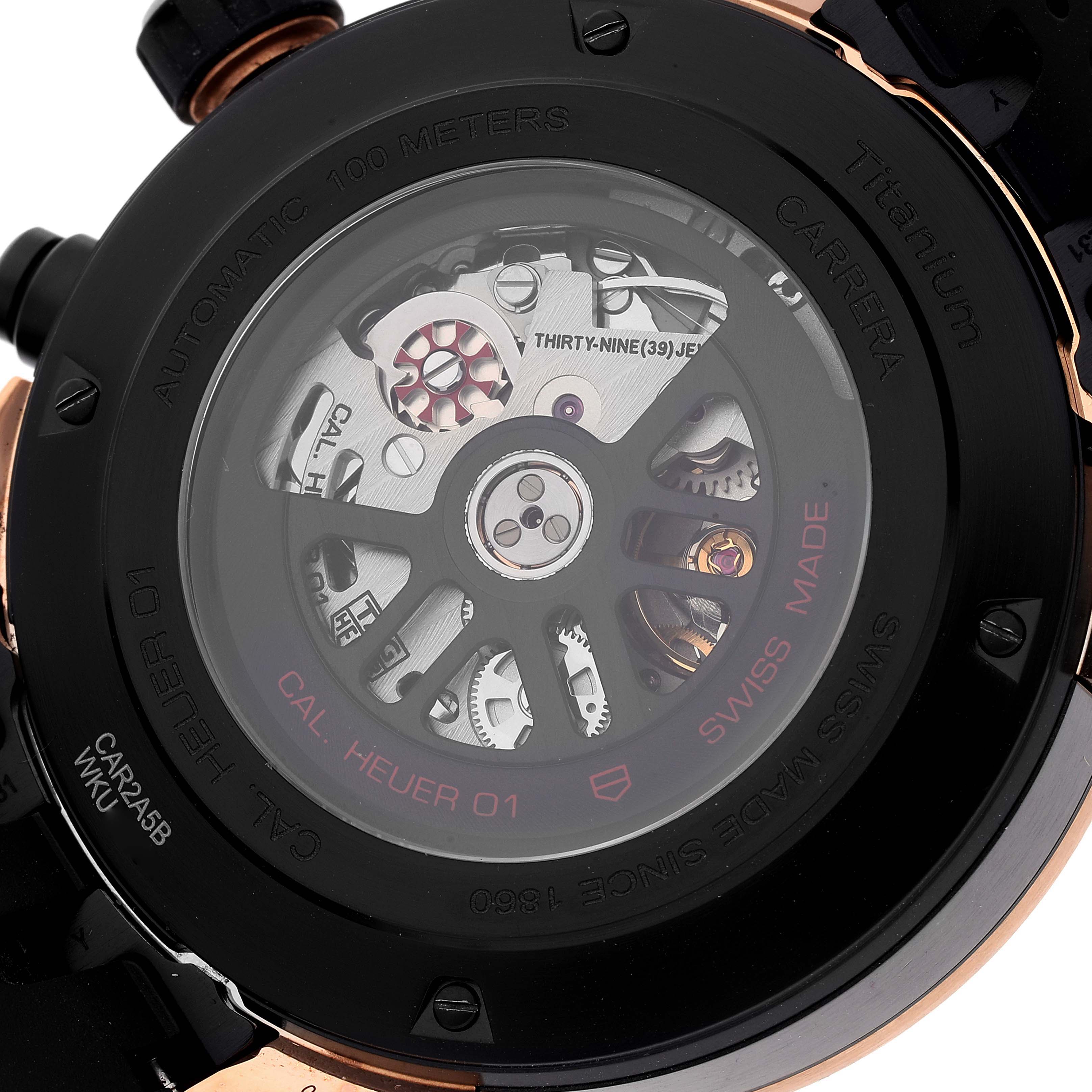 This image shows the back view of a Tag Heuer Carrera CAR2A5B.FT6044 Men's Steel and Gold (two tone) Black Dial CAR2A5B.FT6044 Men's Steel and Gold (two tone) Black Dial watch, displaying the automatic movement mechanisms and inscriptions.