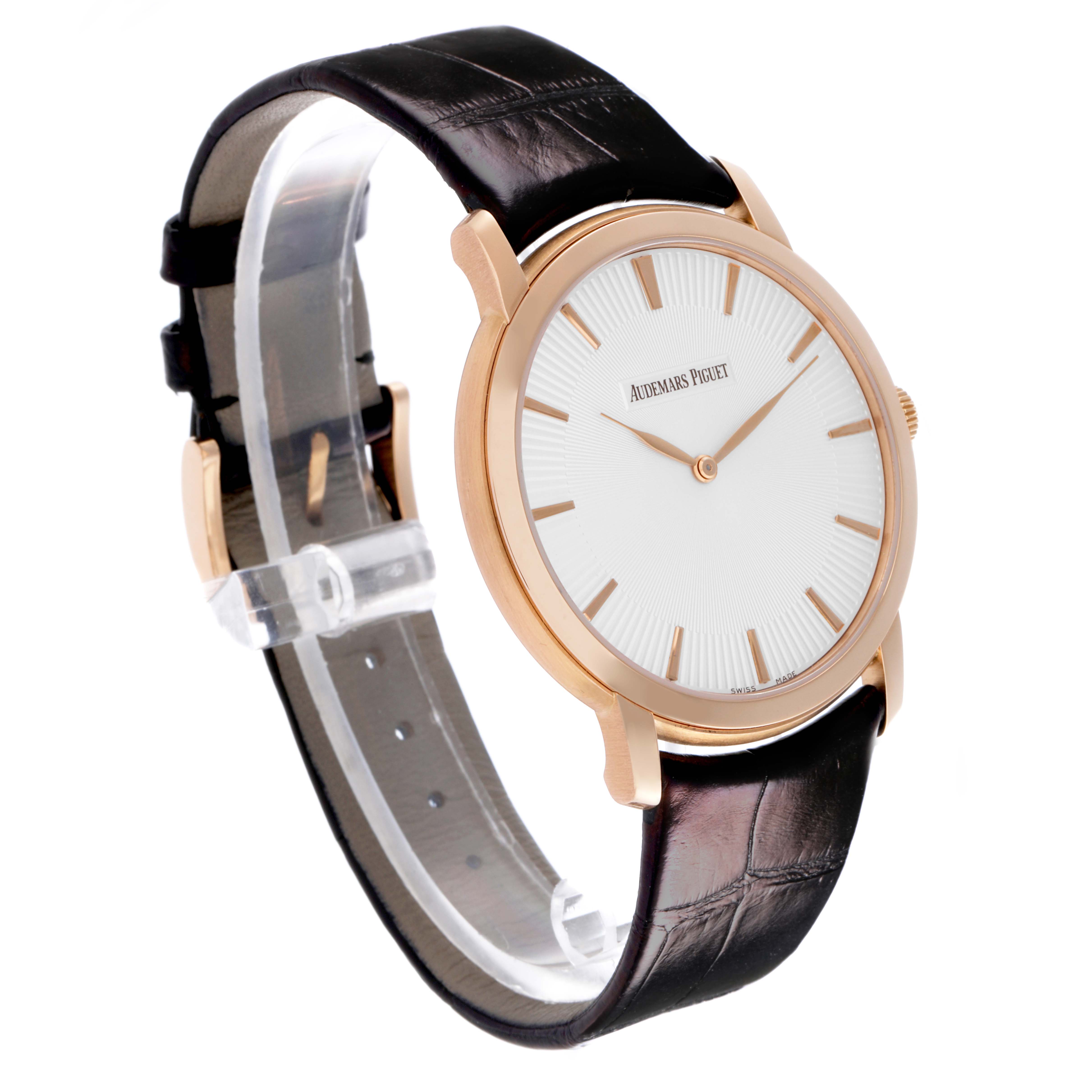 The Audemars Piguet Jules 15180OR.OO.A102CR.01 Men's Rose Gold Silver Dial 15180OR.OO.A102CR.01 Men's Rose Gold Silver Dial watch is shown at a slight angle, highlighting the dial, case, crown, and part of the leather strap.