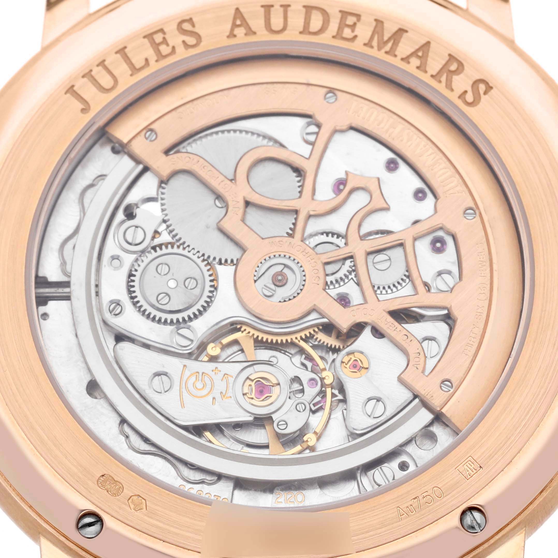 The image shows the back view of the Audemars Piguet Jules 15180OR.OO.A102CR.01 Men's Rose Gold Silver Dial 15180OR.OO.A102CR.01 Men's Rose Gold Silver Dial watch, revealing its intricate mechanical movement.