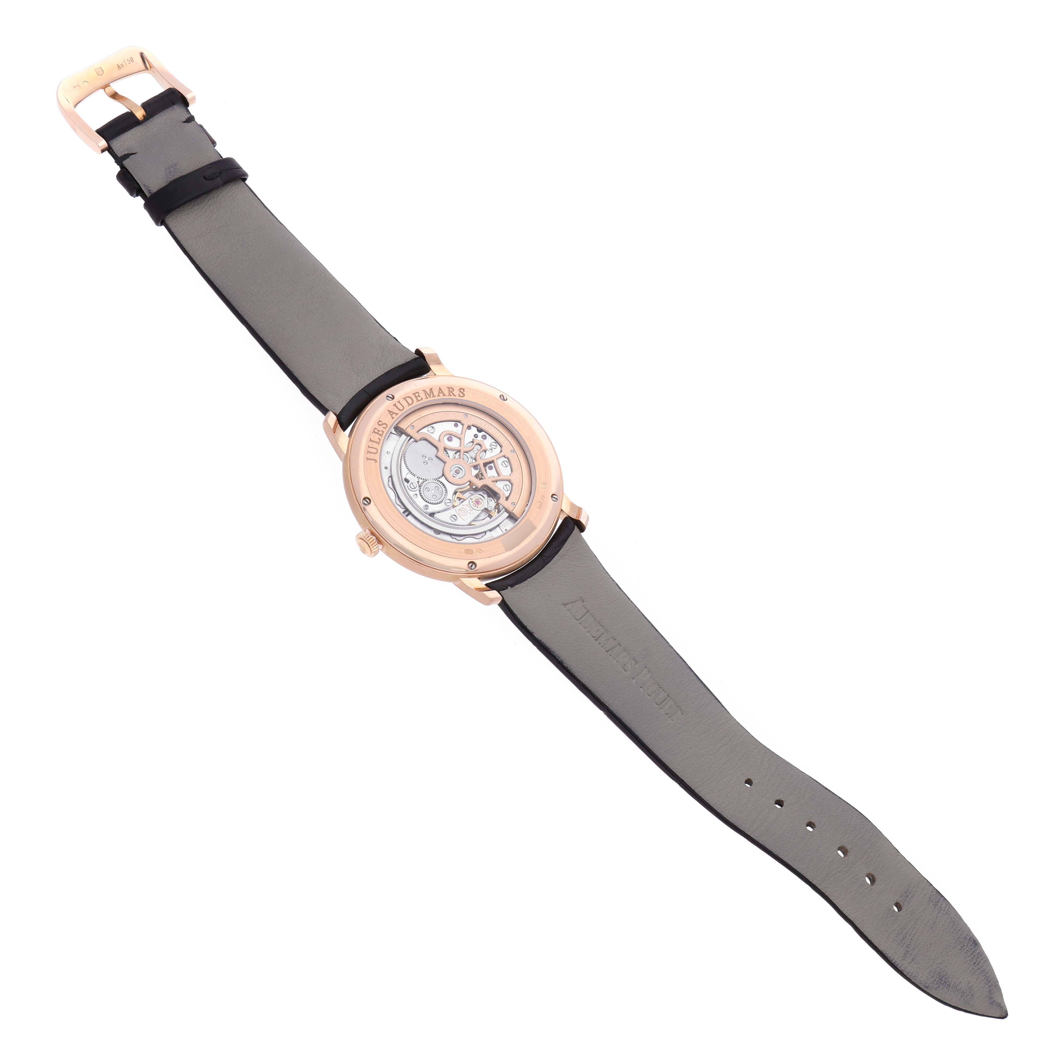 The image shows the back view of the Audemars Piguet Jules 15180OR.OO.A102CR.01 Men's Rose Gold Silver Dial 15180OR.OO.A102CR.01 Men's Rose Gold Silver Dial watch, highlighting its movement and leather strap.