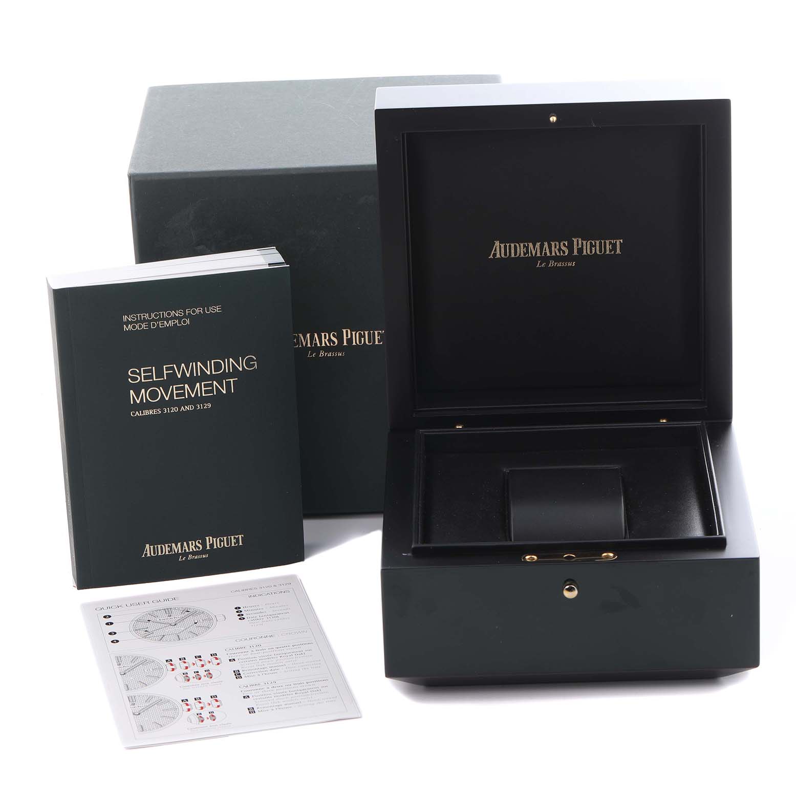 The image shows a box, manual, and documents for the Jules model by Audemars Piguet from an angled top view.