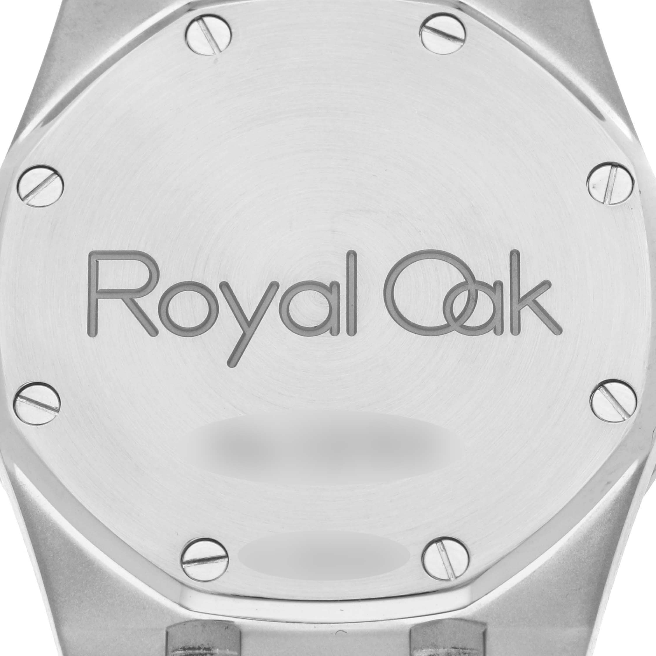 The image shows the back case of the Audemars Piguet Royal Oak 15000ST.OO.0789ST.06 Men's Stainless Steel Blue Dial 15000ST.OO.0789ST.06 Men's Stainless Steel Blue Dial watch, displaying its logo and visible screws.