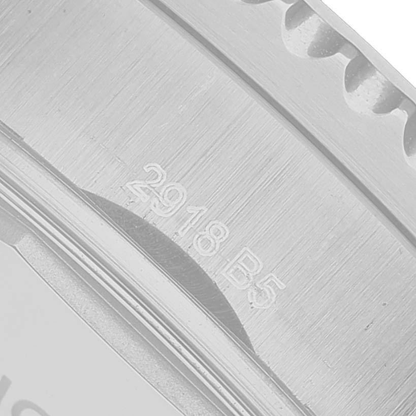 The image shows a close-up of the case side and bezel of the Breitling Aviator A13316 Men's Stainless Steel Black Dial watch with engraved numbers.