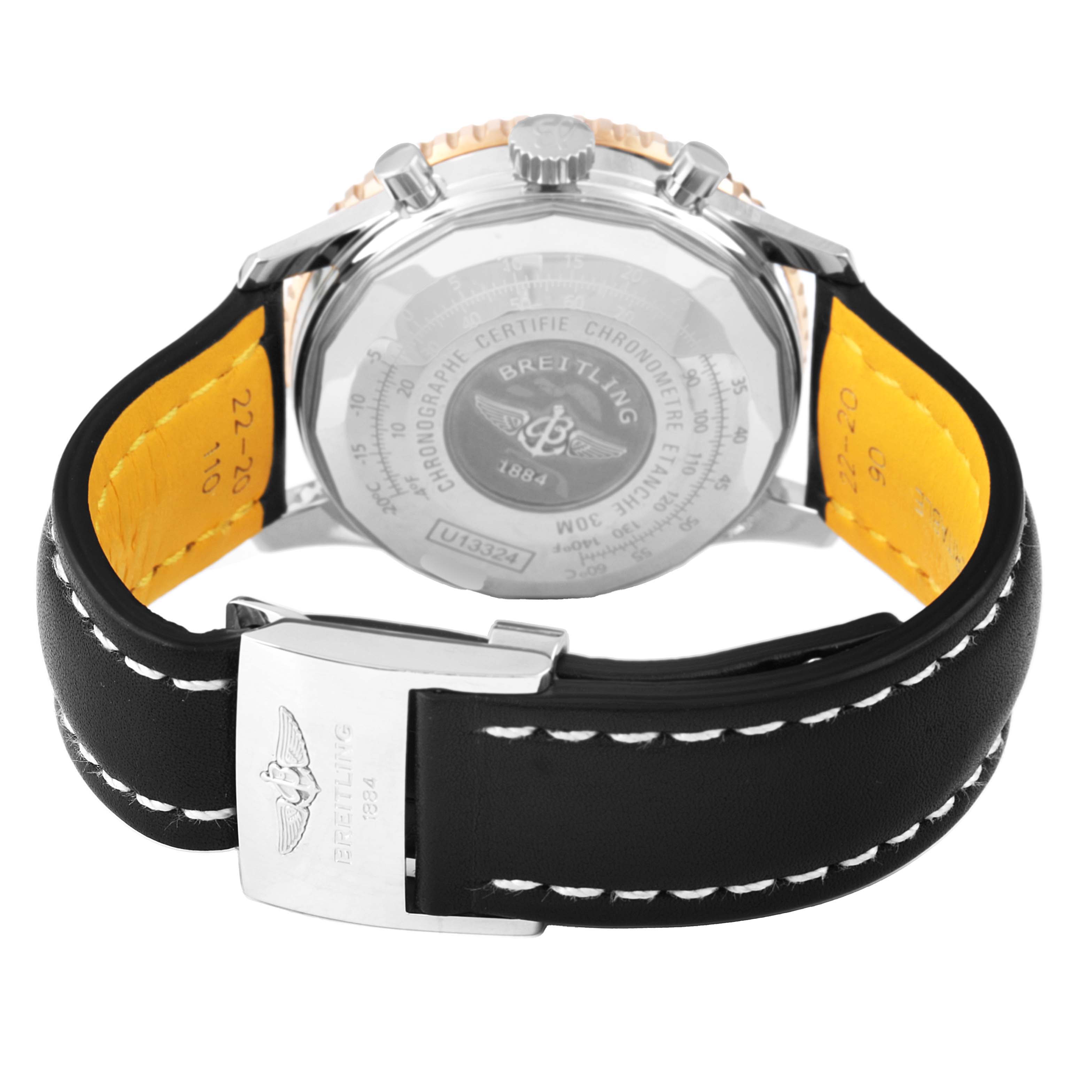 The image shows the back view of a Breitling Navitimer U13324 Men's Stainless Steel Black Dial watch with emphasis on the case back and leather strap.