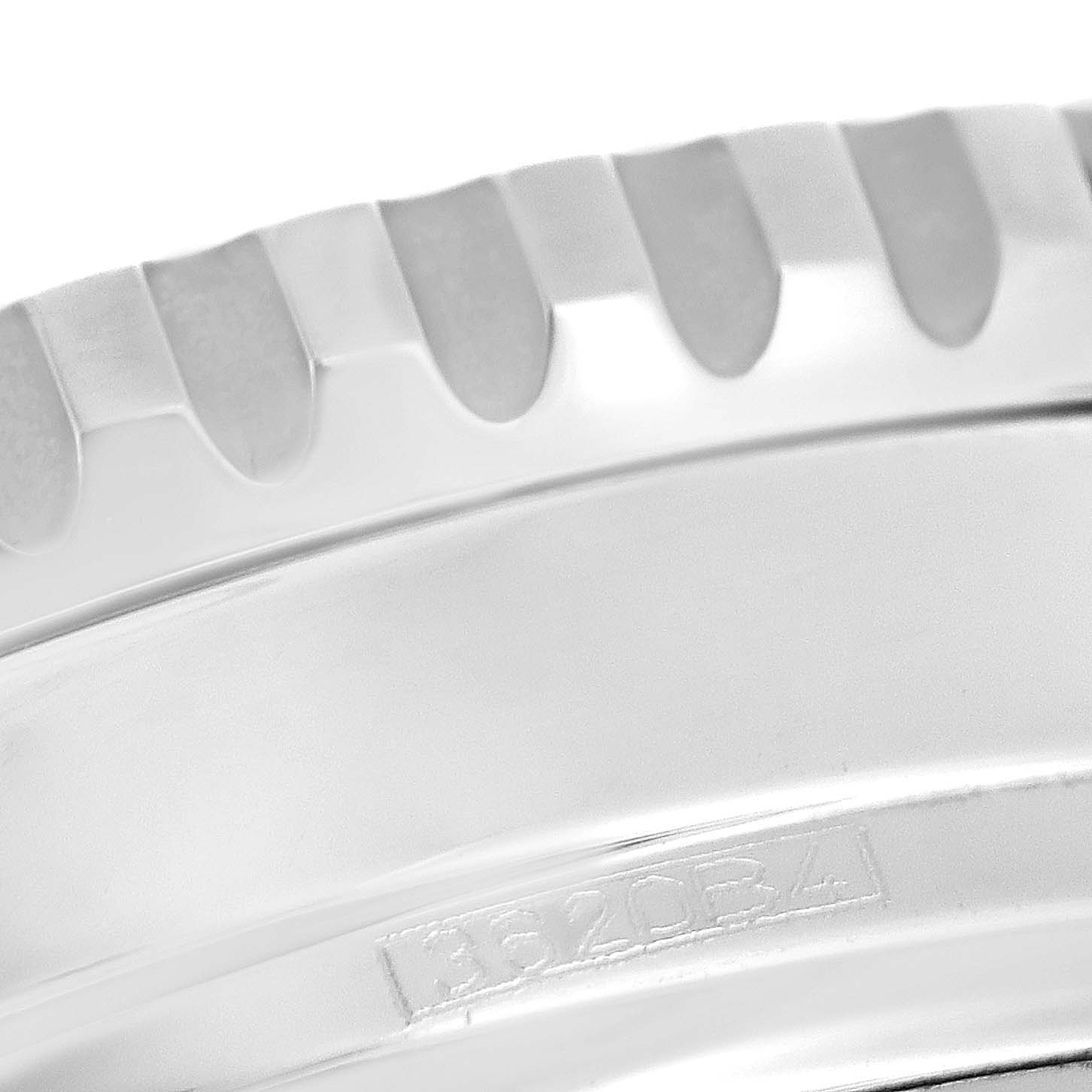 This close-up image shows the bezel and part of the casing of a Breitling Navitimer A13324 Men
s Stainless Steel Black Dial A13324 Men
s Stainless Steel Black Dial watch, highlighting its engravings and ridged details.