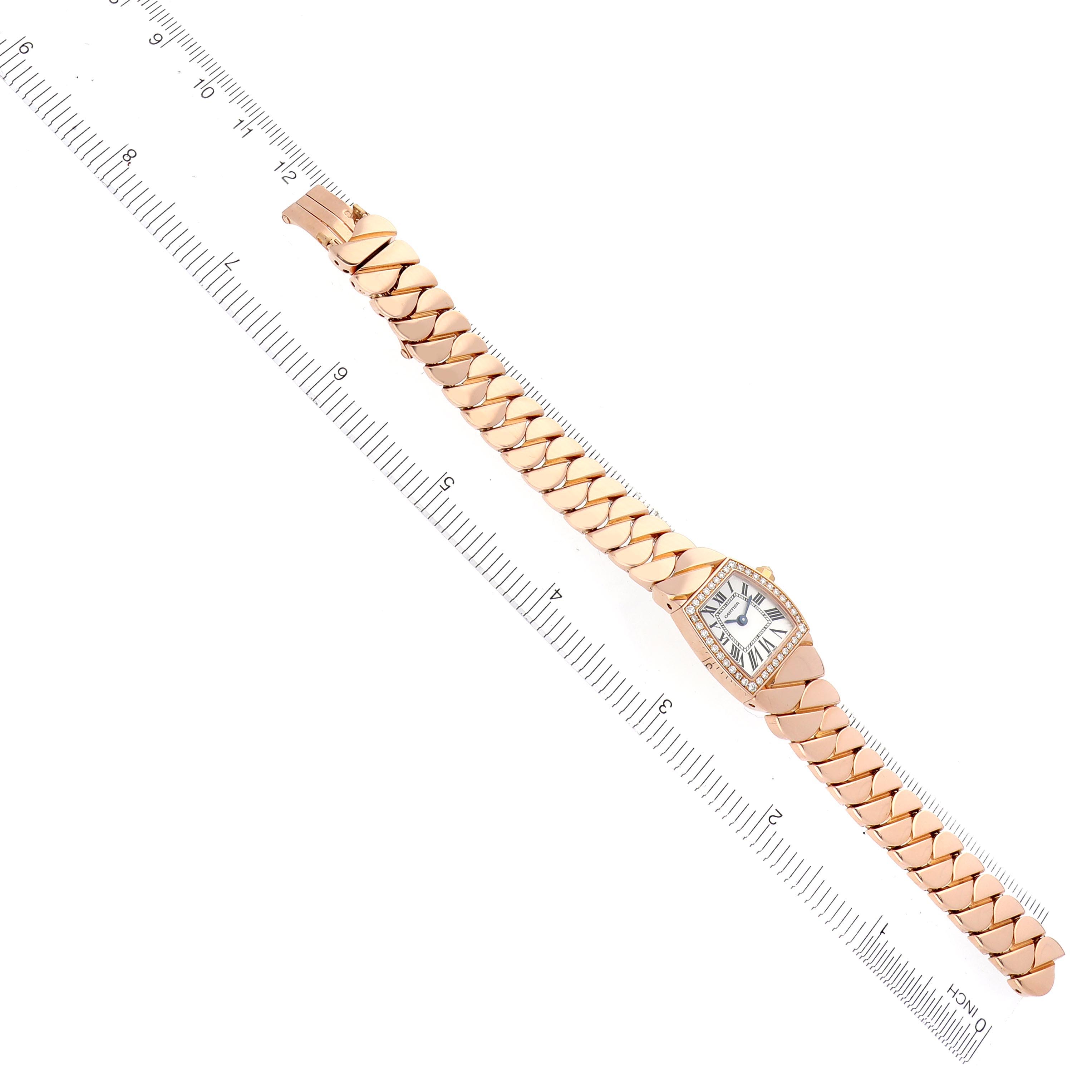 The Cartier La Dona WE60086I Women's Rose Gold Silver Dial WE60086I Women's Rose Gold Silver Dial watch is shown from a top-down angle with its face and entire bracelet visible alongside a measuring ruler.