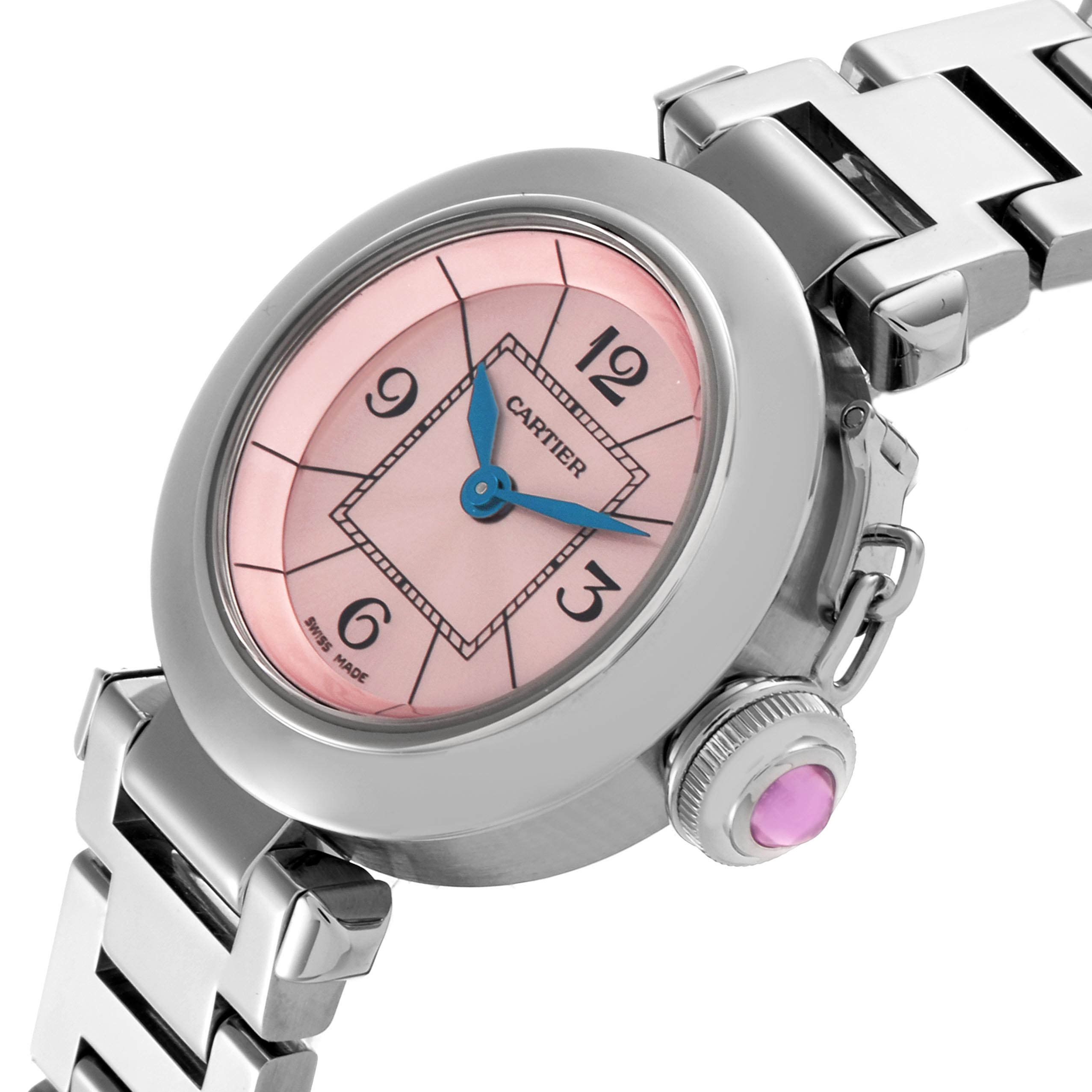 The Cartier Pasha W3140008 Women
s Stainless Steel Pink Dial W3140008 Women
s Stainless Steel Pink Dial watch is shown at an angle displaying its pink dial, blue hands, crown, and part of the bracelet.