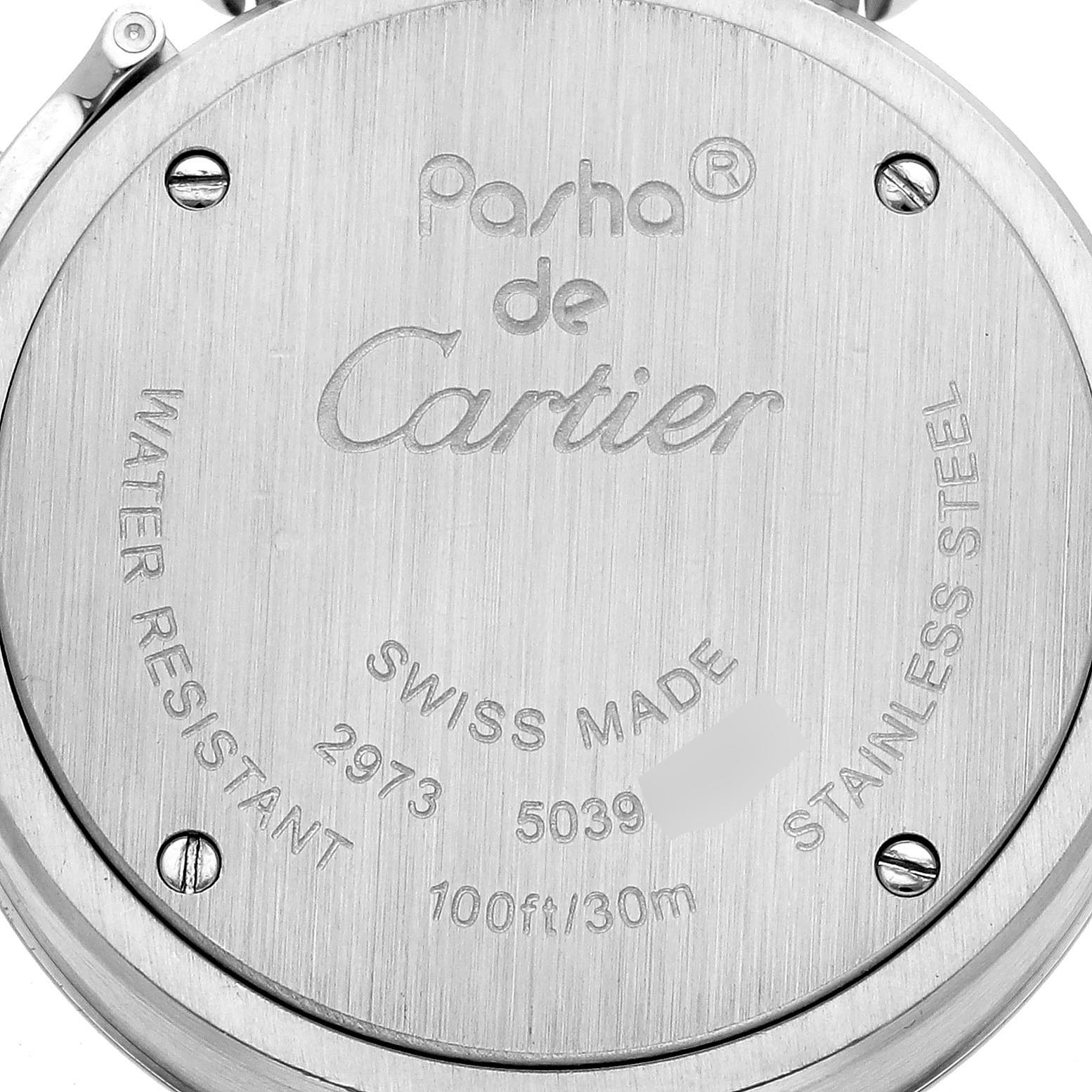 The image shows the back case of the Cartier Pasha W3140008 Women
s Stainless Steel Pink Dial W3140008 Women
s Stainless Steel Pink Dial watch, highlighting its engravings and screws.