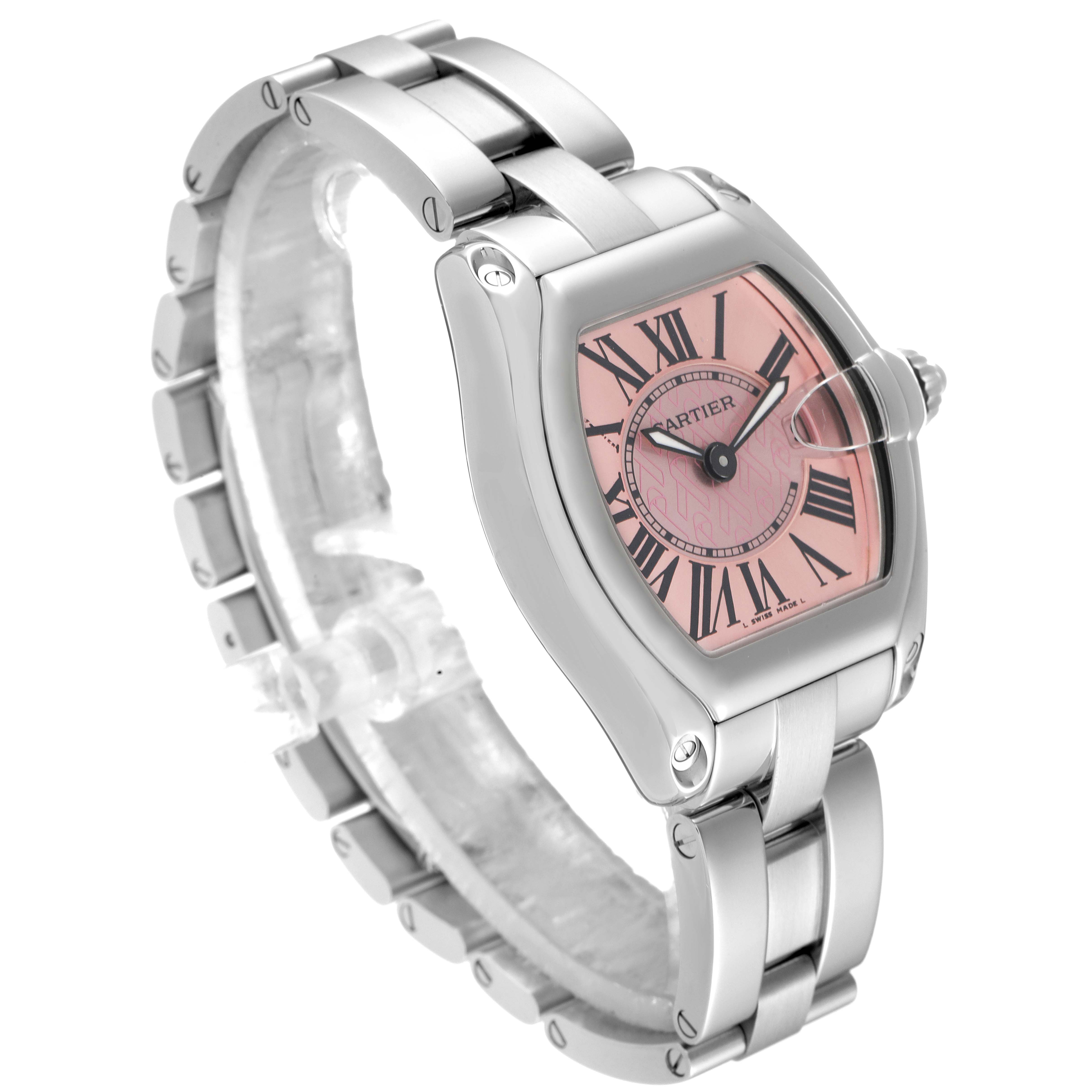 The Cartier Roadster W62043V3 Women's Stainless Steel Pink Dial W62043V3 Women's Stainless Steel Pink Dial watch is shown at a three-quarter angle, highlighting its stainless steel bracelet and pink dial.
