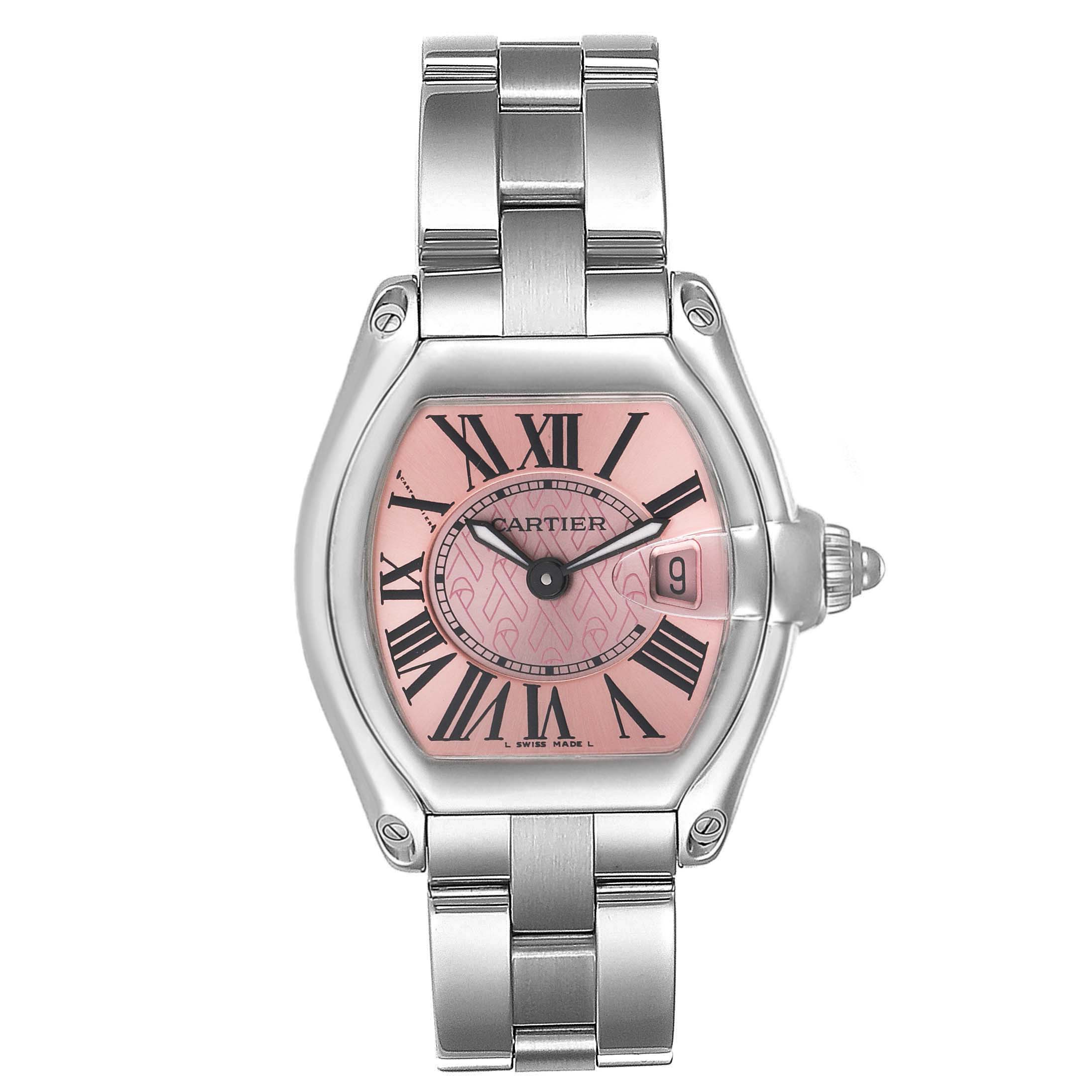 The Cartier Roadster W62043V3 Women's Stainless Steel Pink Dial W62043V3 Women's Stainless Steel Pink Dial watch is shown from the front, displaying its pink dial, Roman numerals, and metal bracelet.