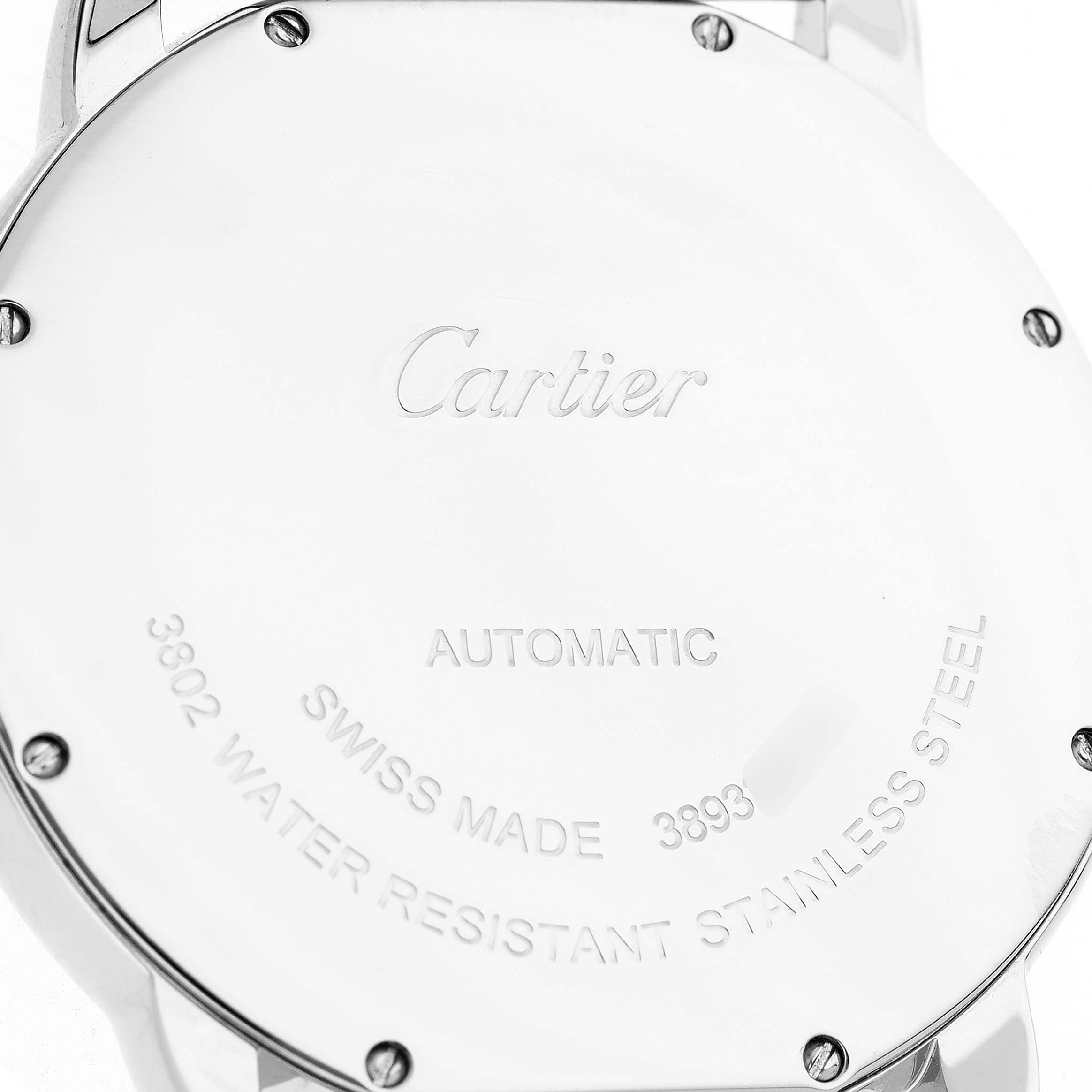 The image shows the back of the Cartier Ronde WSRN0023 Men's Stainless Steel Blue Dial watch, featuring engraved markings and screws.