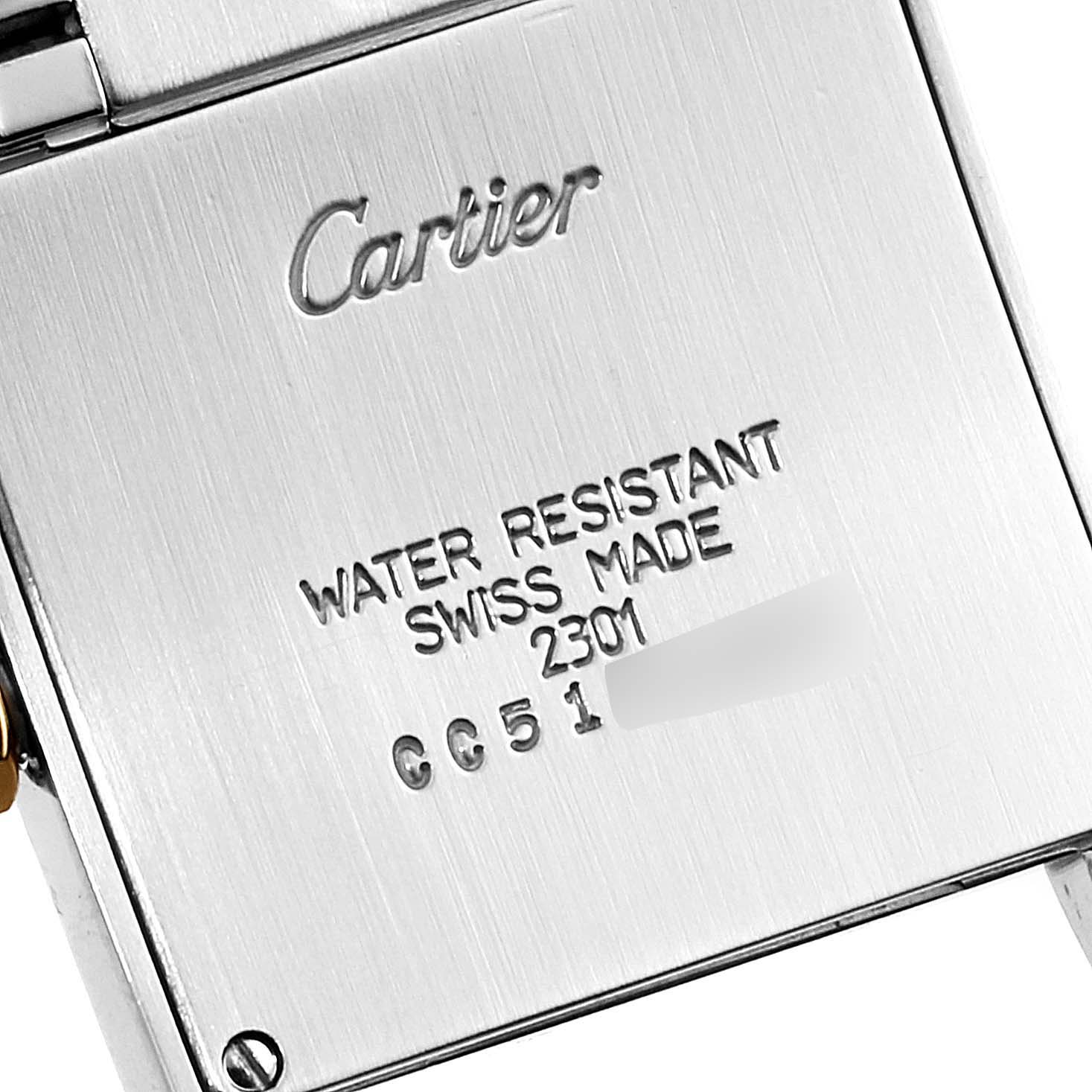 This is a close-up of the back case of a Cartier Tank Française watch showing its engraving and model information.