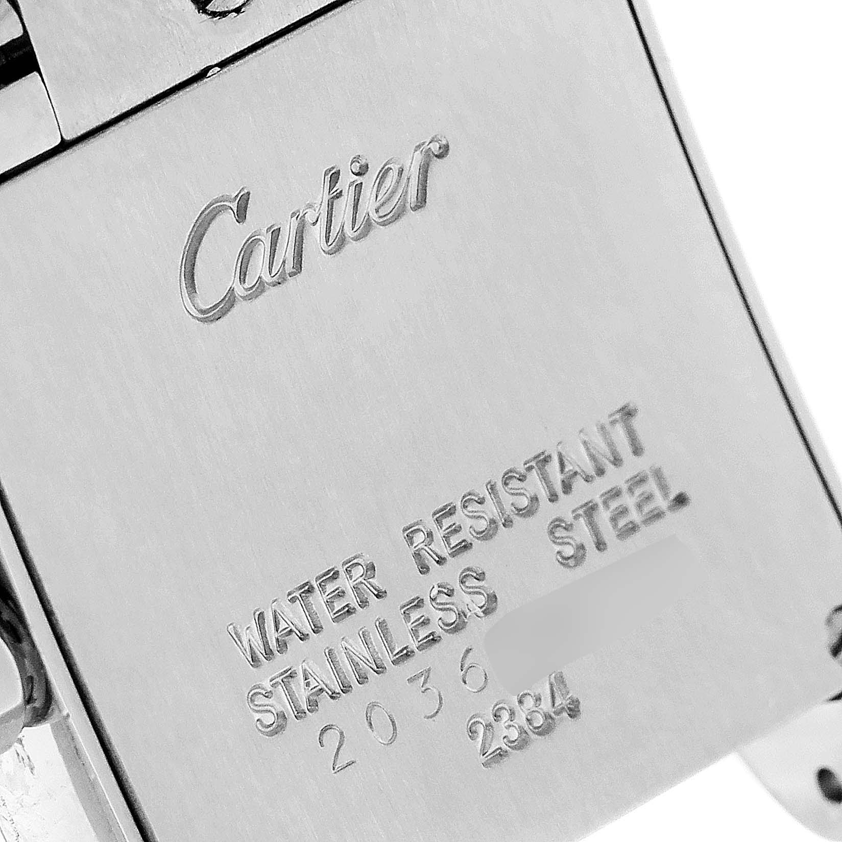 The image shows the back case of a Cartier Tank Francaise W51008Q3 Women
s Stainless Steel Silver Dial W51008Q3 Women
s Stainless Steel Silver Dial watch, highlighting the engraved brand name and specifications.