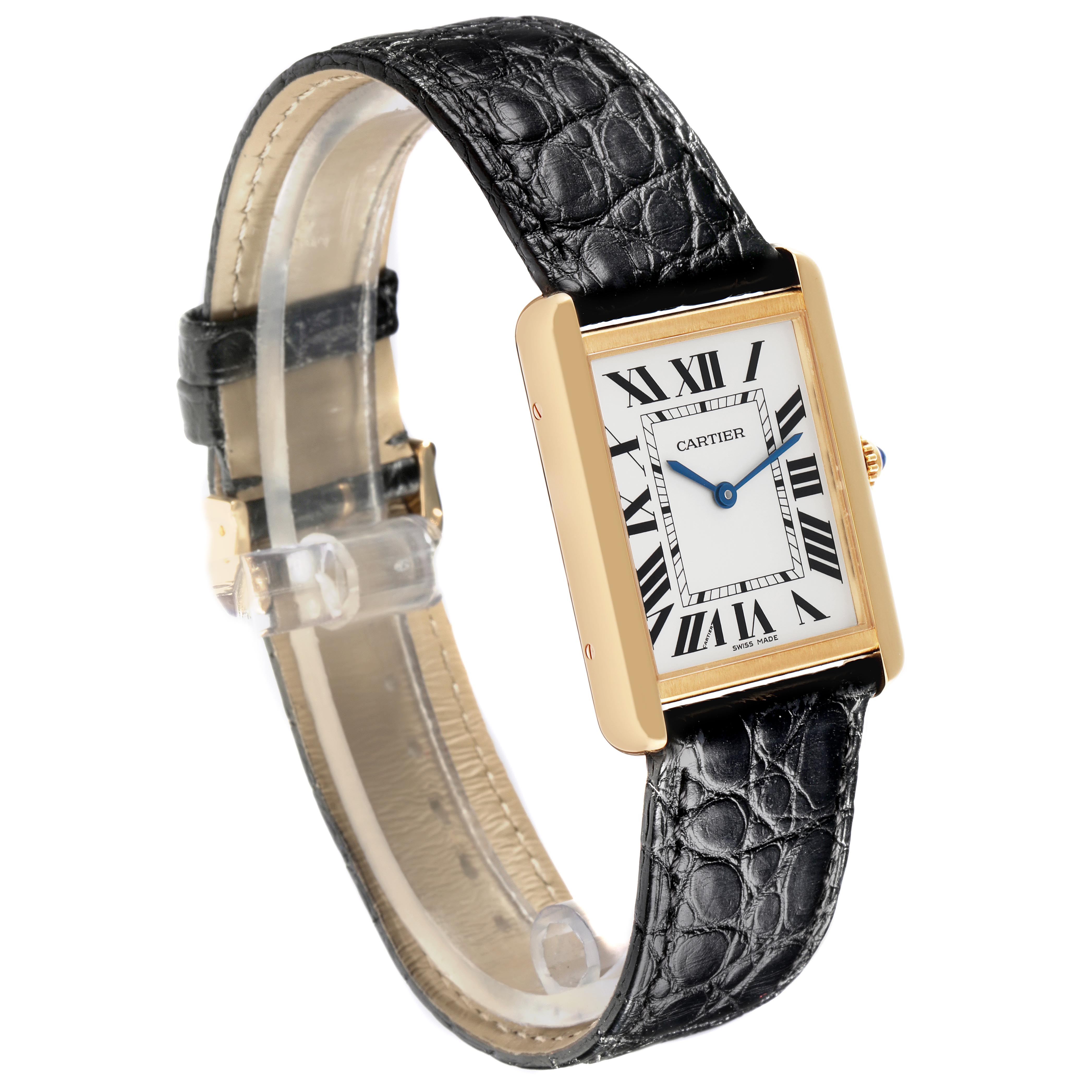 The Cartier Tank Solo W5200004 Men
s Steel and Gold (two tone) Silver Dial W5200004 Men
s Steel and Gold (two tone) Silver Dial watch is shown at an angle highlighting its rectangular face, gold case, Roman numerals, and black leather strap.