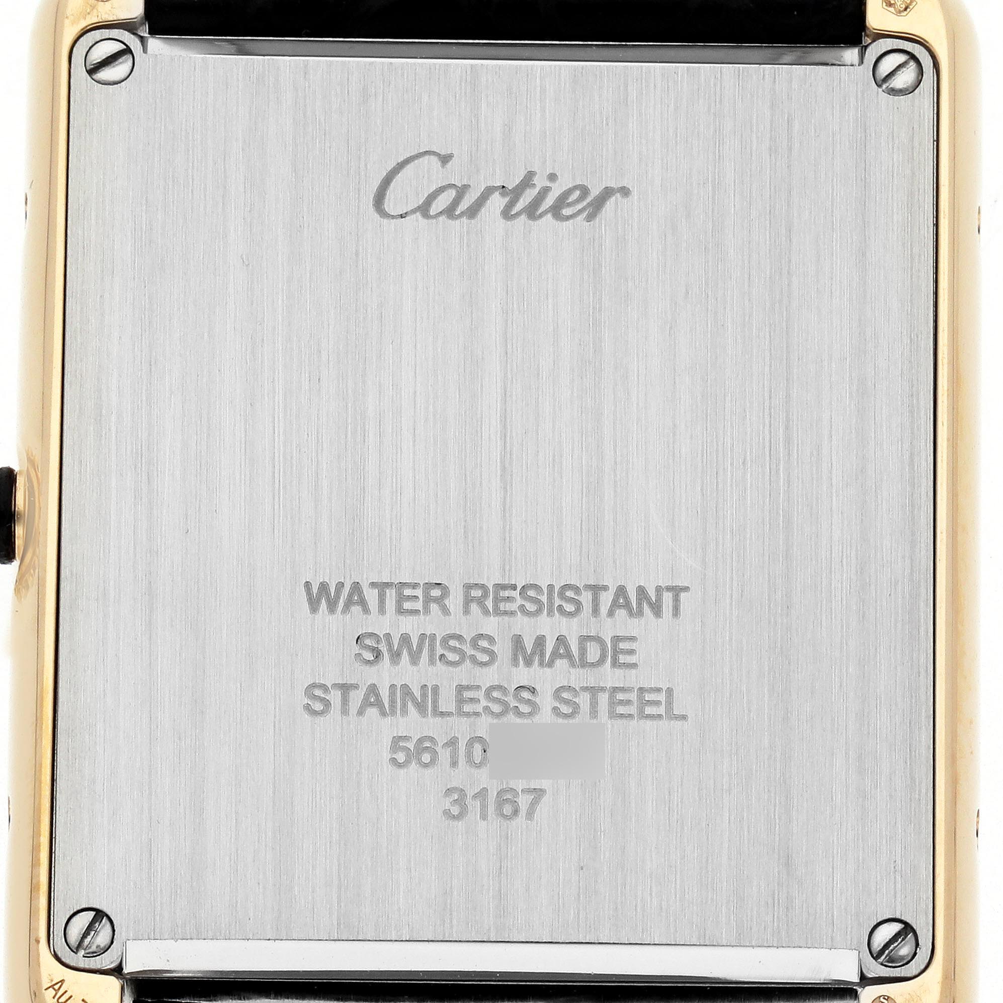 The image shows the back of the Cartier Tank Solo W5200004 Men
s Steel and Gold (two tone) Silver Dial W5200004 Men
s Steel and Gold (two tone) Silver Dial watch, featuring its stainless steel case and engraving details.