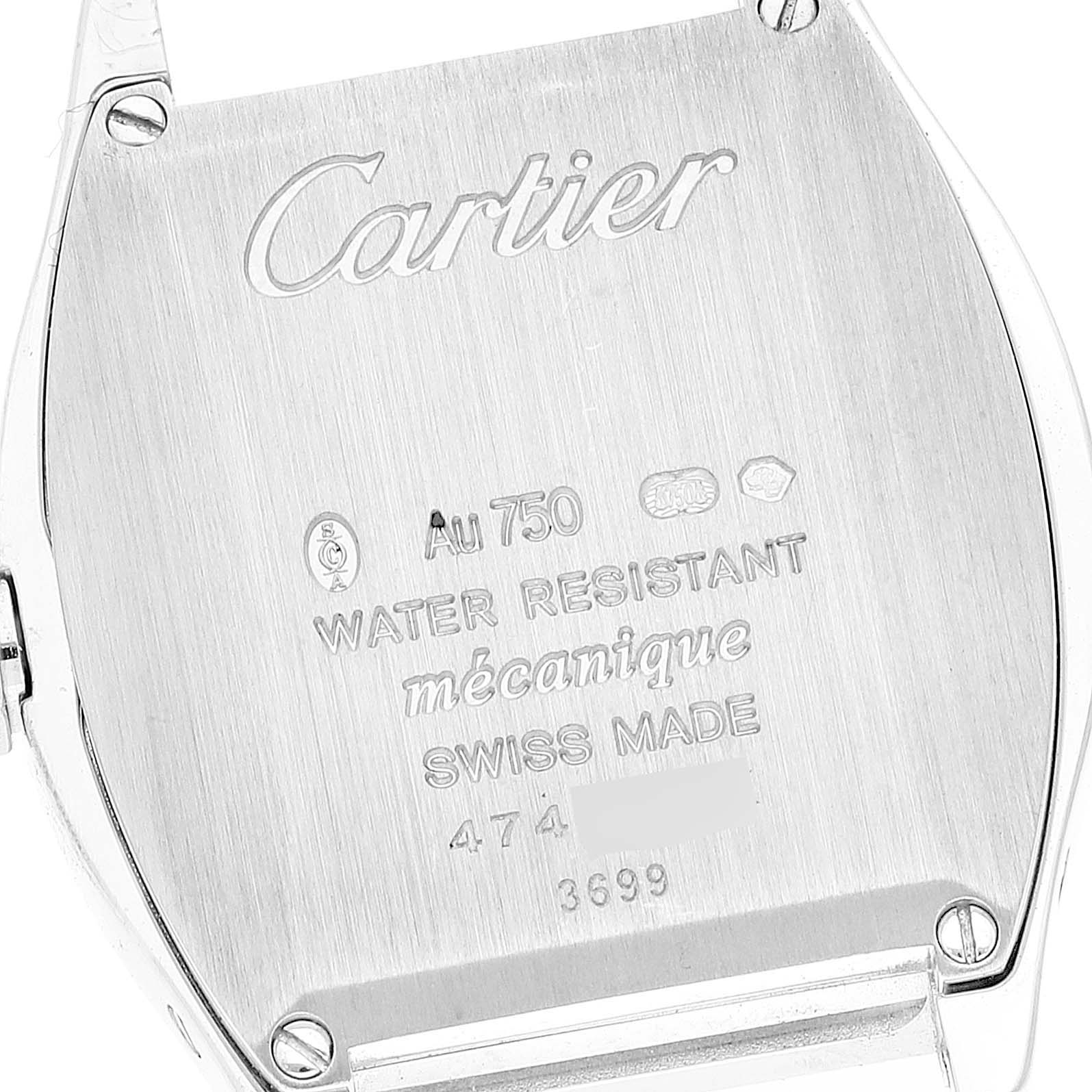 The image shows the back of the Cartier Tortue WA501007 Women's White Gold Silver Dial watch, highlighting engravings and screws.