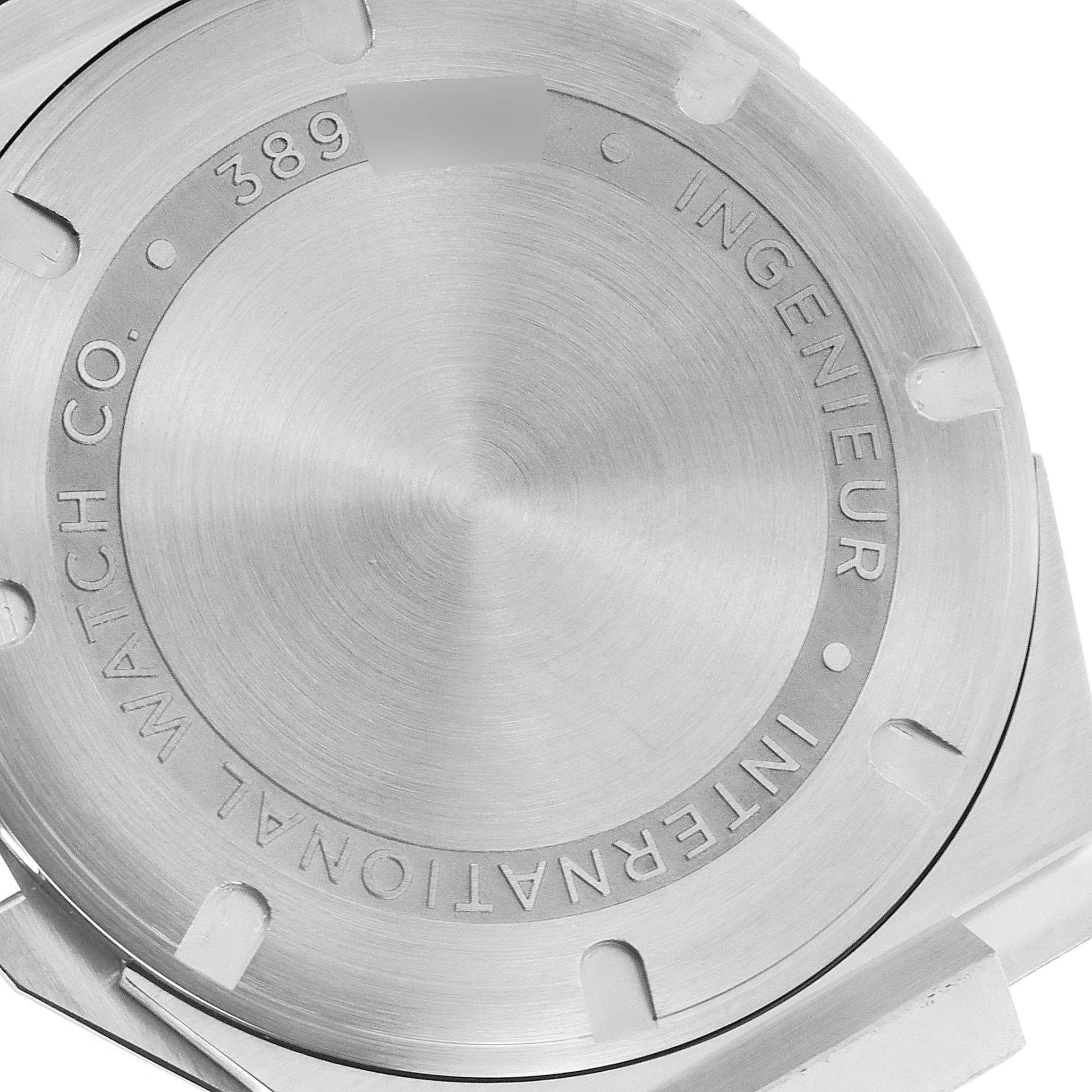 The image shows the stainless steel case back of the IWC Ingenieur IW323904 Men's Stainless Steel Silver Dial IW323904 Men's Stainless Steel Silver Dial watch model at an angled close-up.