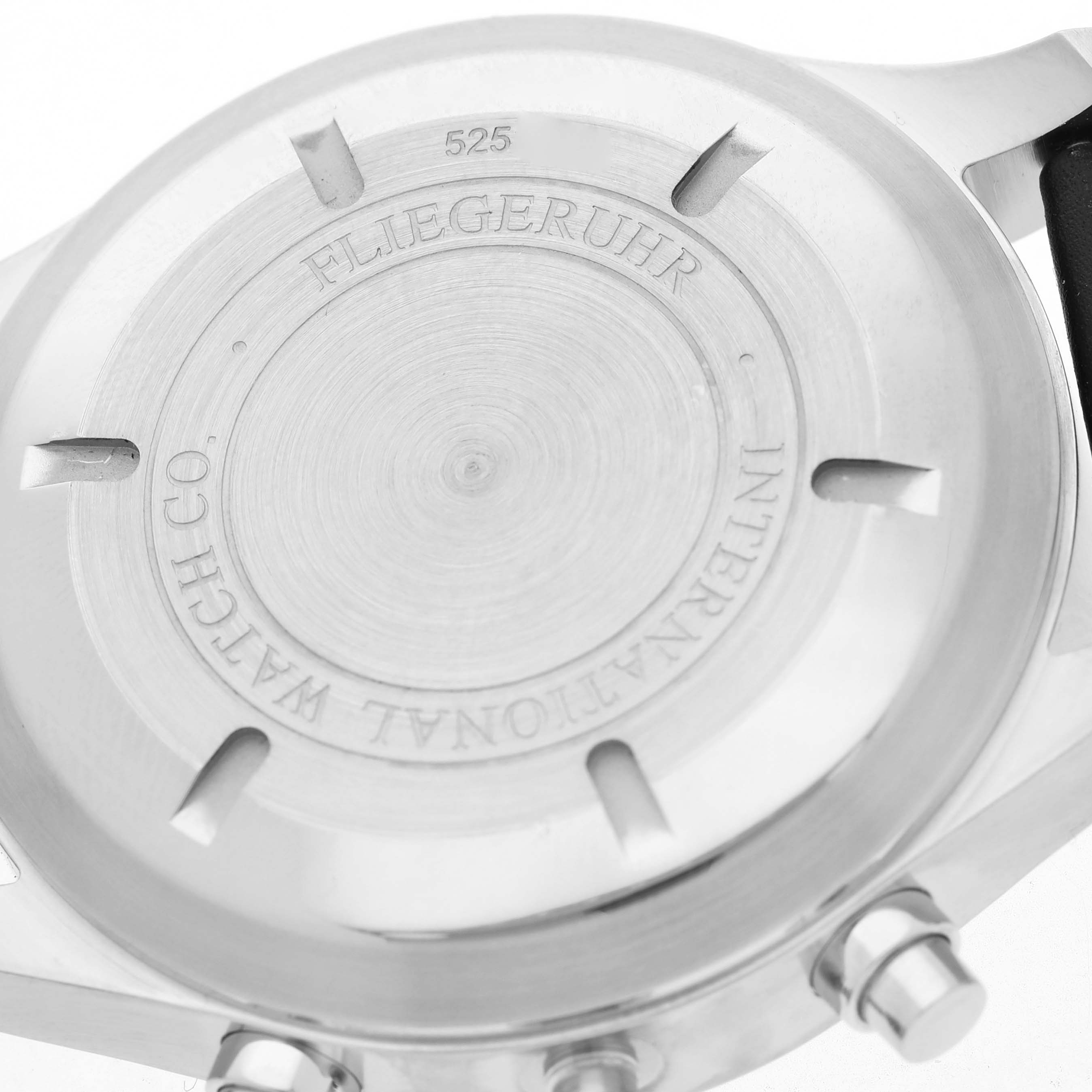 The image shows the back case of the IWC Pilot IW377701 Men's Stainless Steel Black Dial watch, highlighting its engravings and the side buttons.