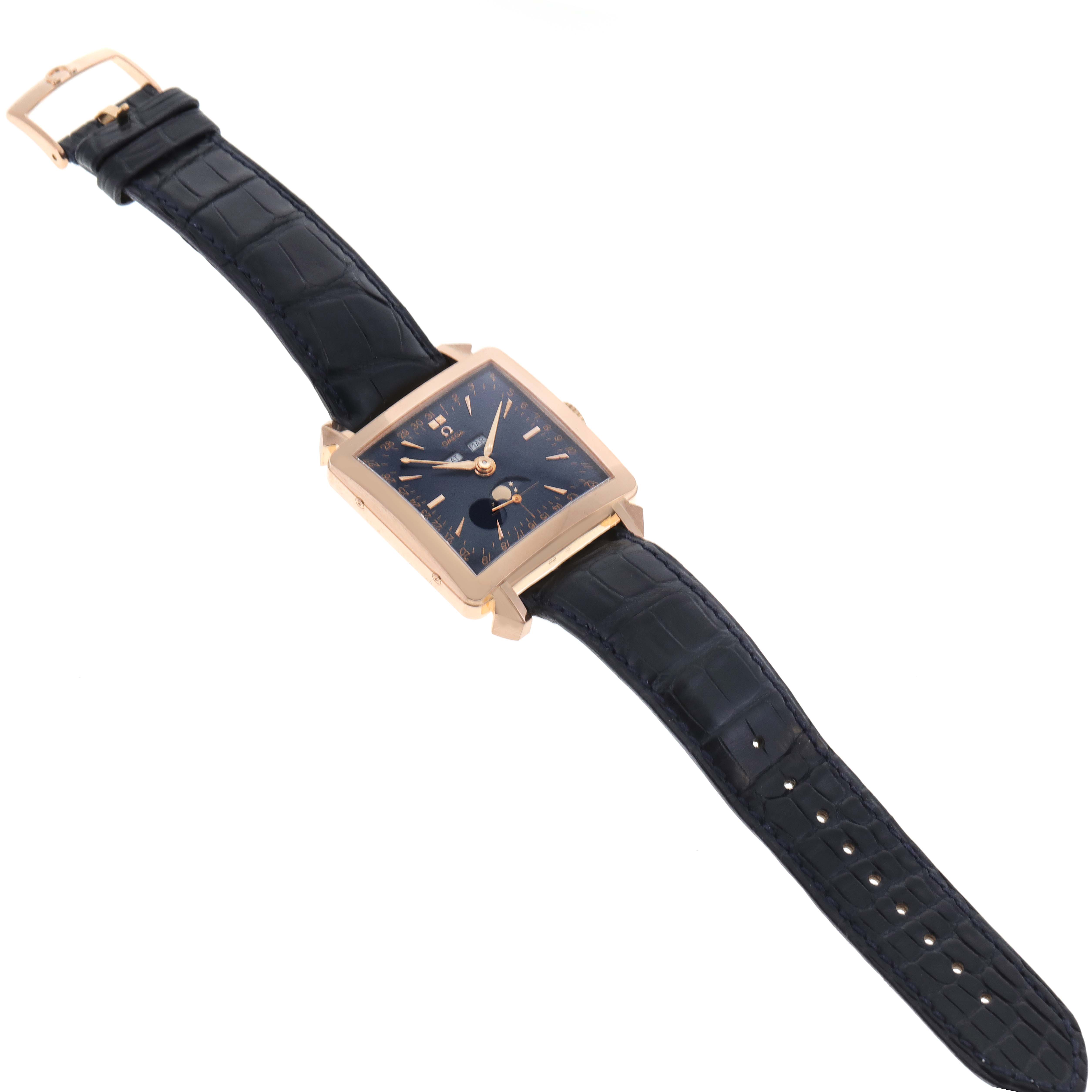 The Omega Museum 5701.80.03 Men's Rose Gold Blue Dial 5701.80.03 Men's Rose Gold Blue Dial model watch is shown at a slight angle displaying its rectangular face and black leather strap.
