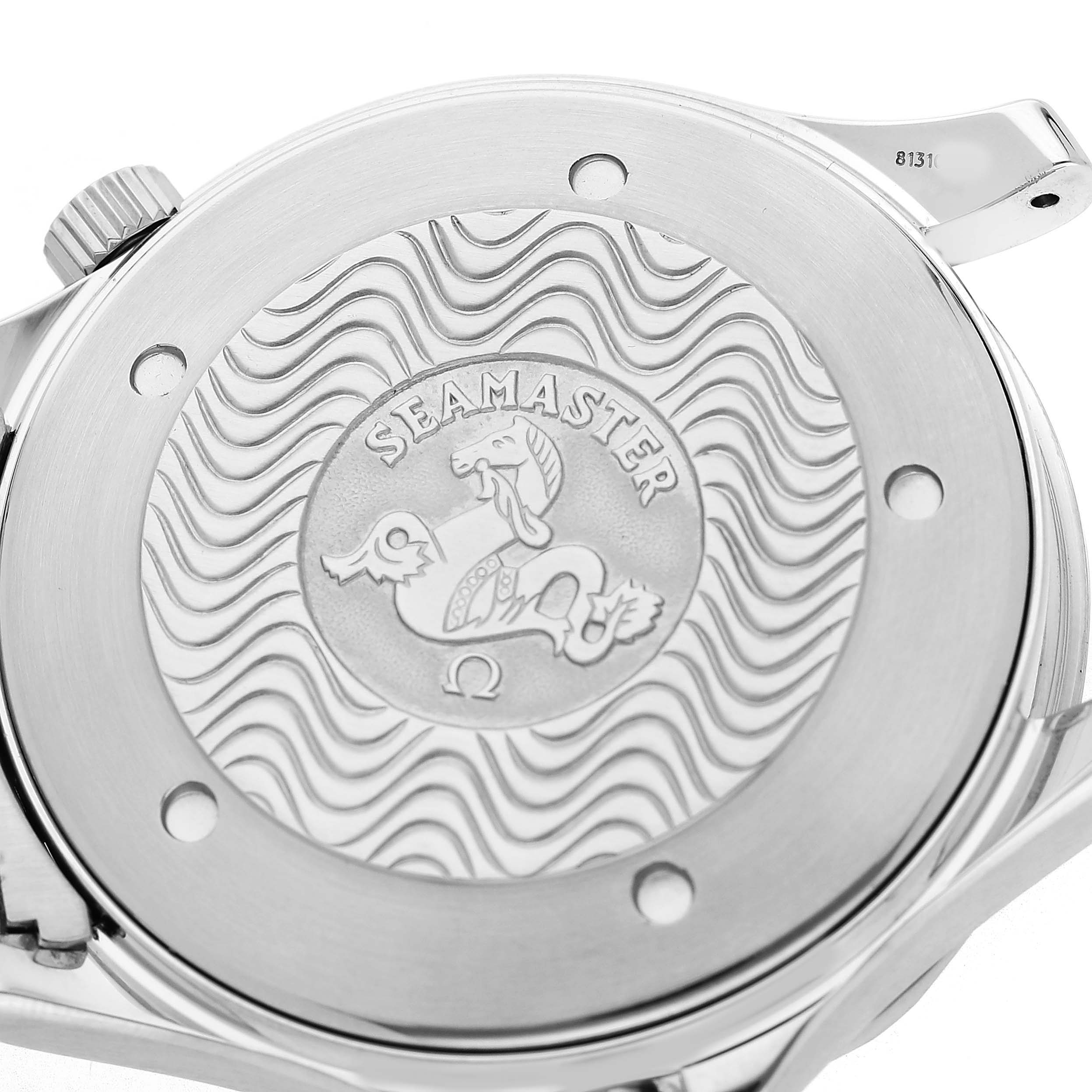 The image shows the back case of an Omega Seamaster 2255.80.00 Men's Stainless Steel Blue Dial watch, featuring an engraved emblem and wave pattern.
