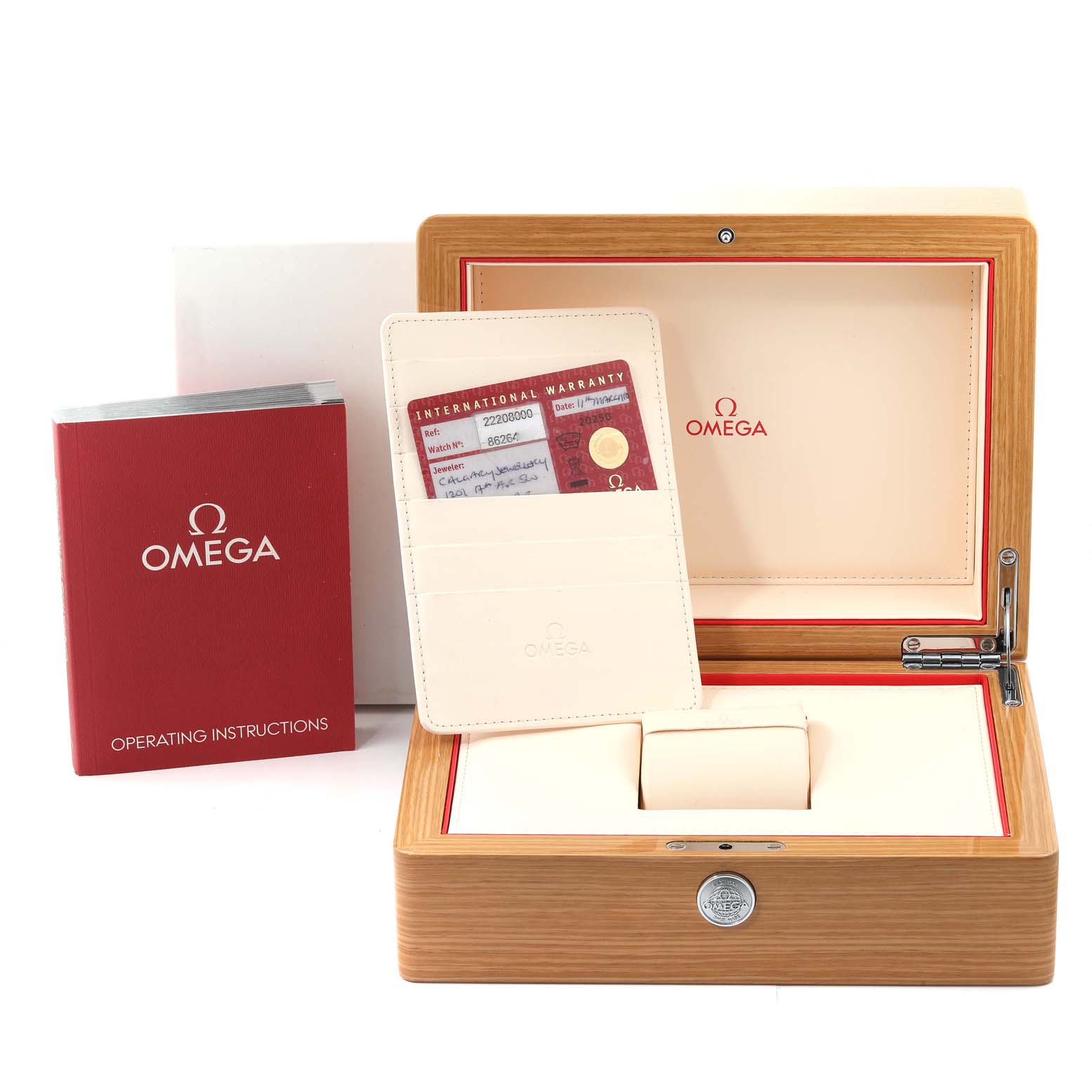 The image shows the accessories of an Omega Seamaster 2220.80.00 Men's Stainless Steel Blue Dial 2220.80.00 Men's Stainless Steel Blue Dial, including the watch box, international warranty card, and operating instructions.