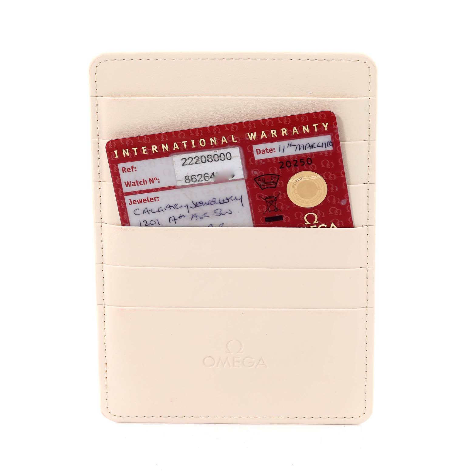 The image shows an Omega Seamaster 2220.80.00 Men's Stainless Steel Blue Dial 2220.80.00 Men's Stainless Steel Blue Dial international warranty card in a cream-colored cardholder.