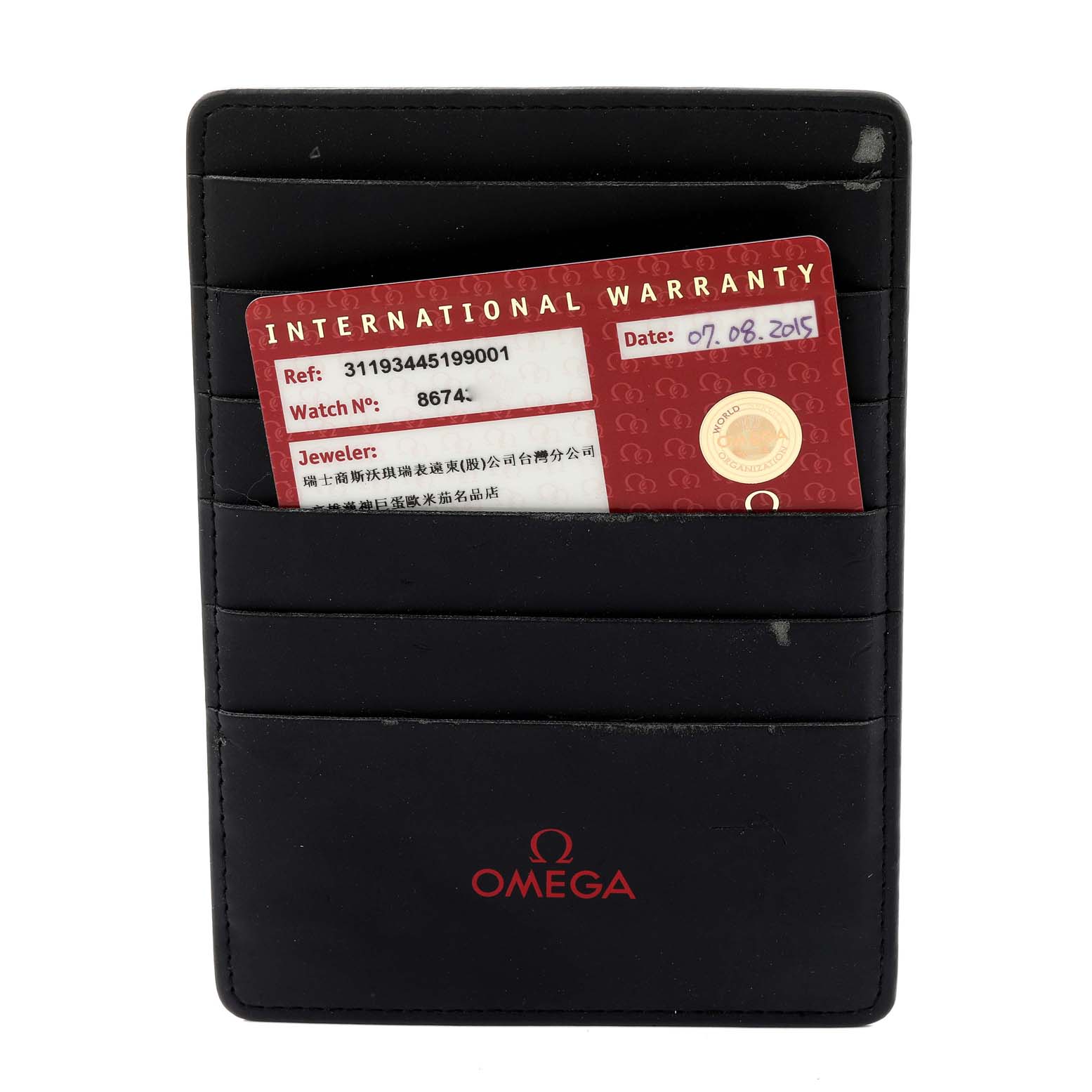 The image shows an Omega Speedmaster 311.93.44.51.99.001 Men's Ceramic Silver Dial 311.93.44.51.99.001 Men's Ceramic Silver Dial International Warranty card in a black leather Omega cardholder.