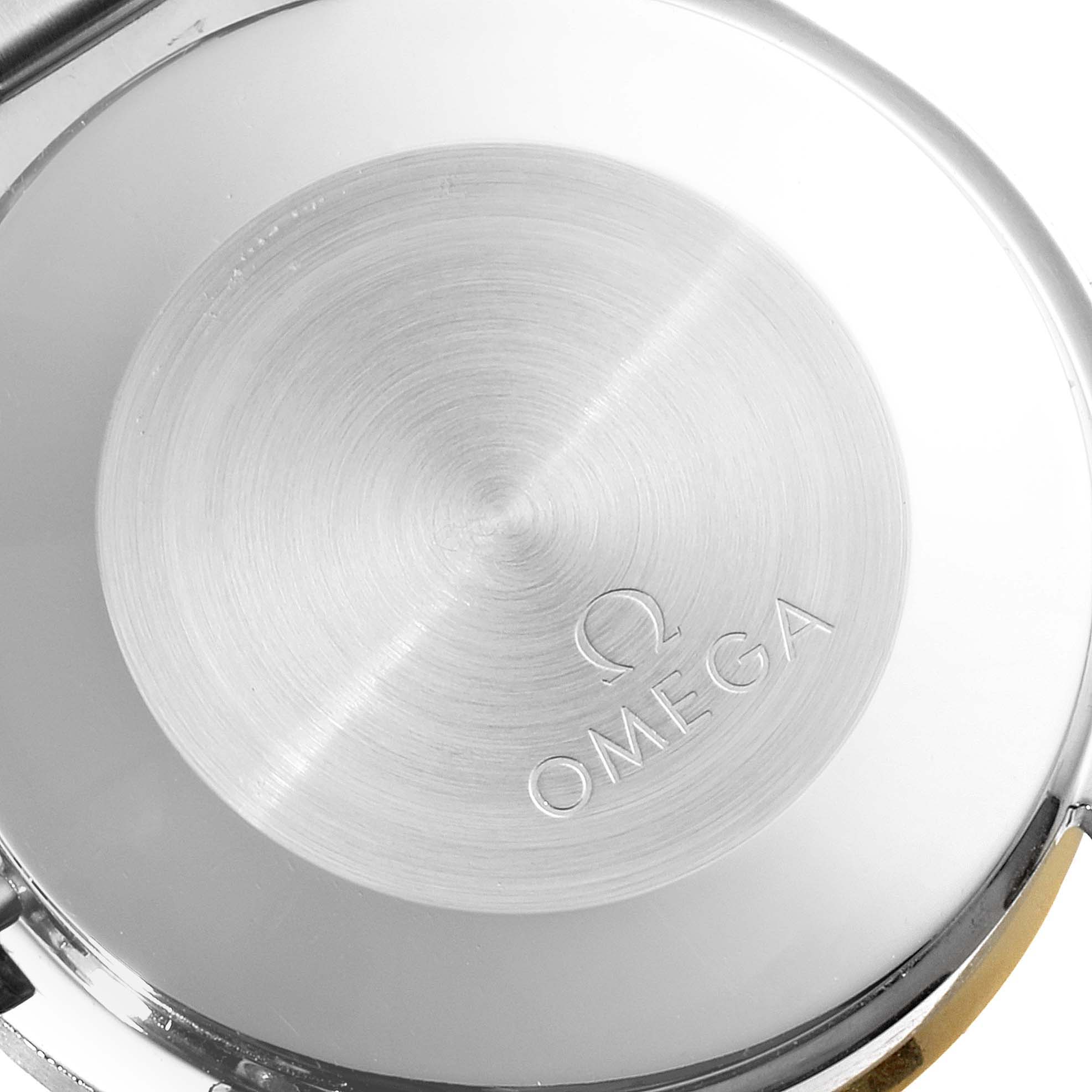 The image shows the case back of an Omega Speedmaster 3310.20.00 Men's Steel and Gold (two tone) White Dial 3310.20.00 Men's Steel and Gold (two tone) White Dial watch, focusing on the engraved Omega logo.