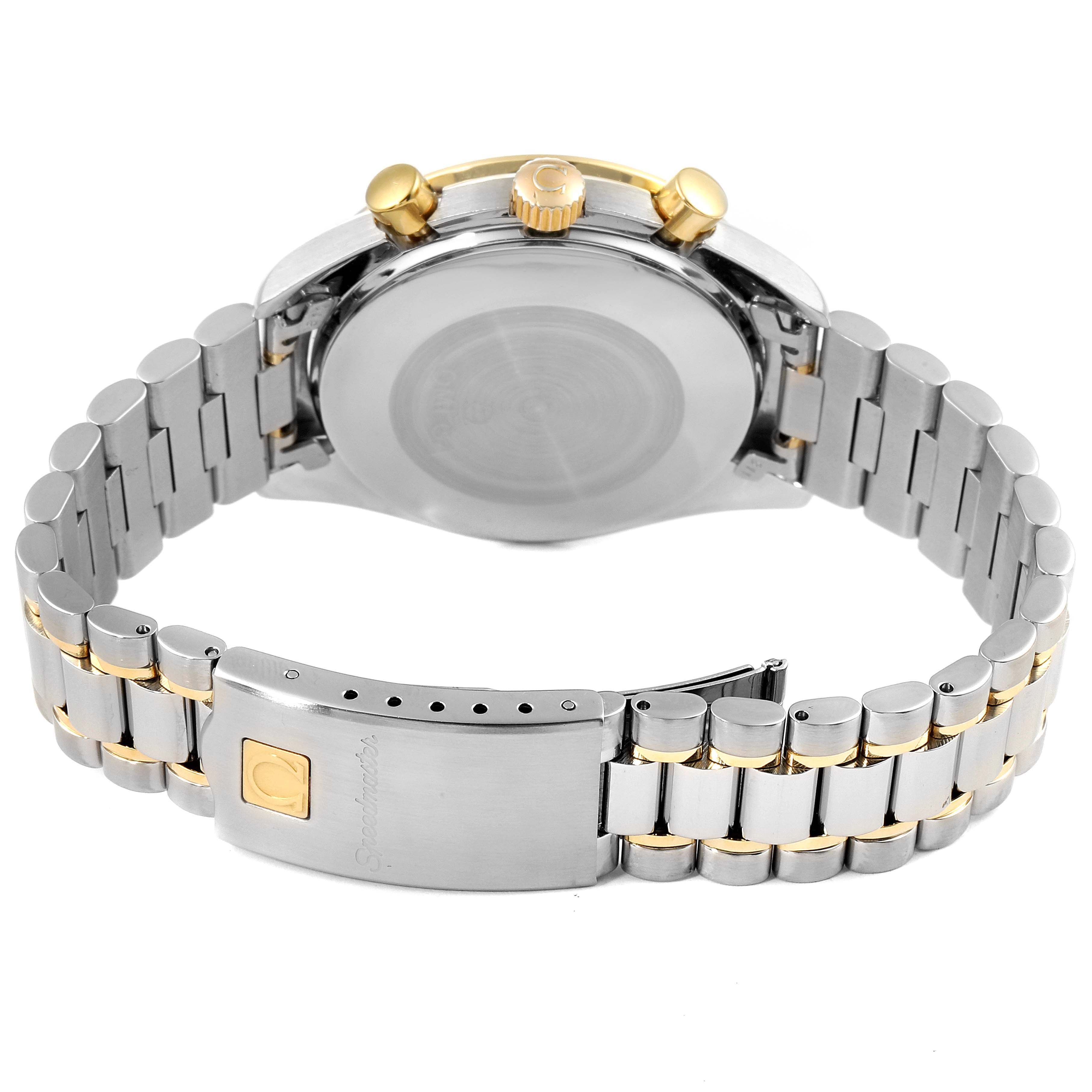 The image shows the back view of an Omega Speedmaster 3310.20.00 Men's Steel and Gold (two tone) White Dial 3310.20.00 Men's Steel and Gold (two tone) White Dial watch, highlighting the band, clasp, and side buttons.