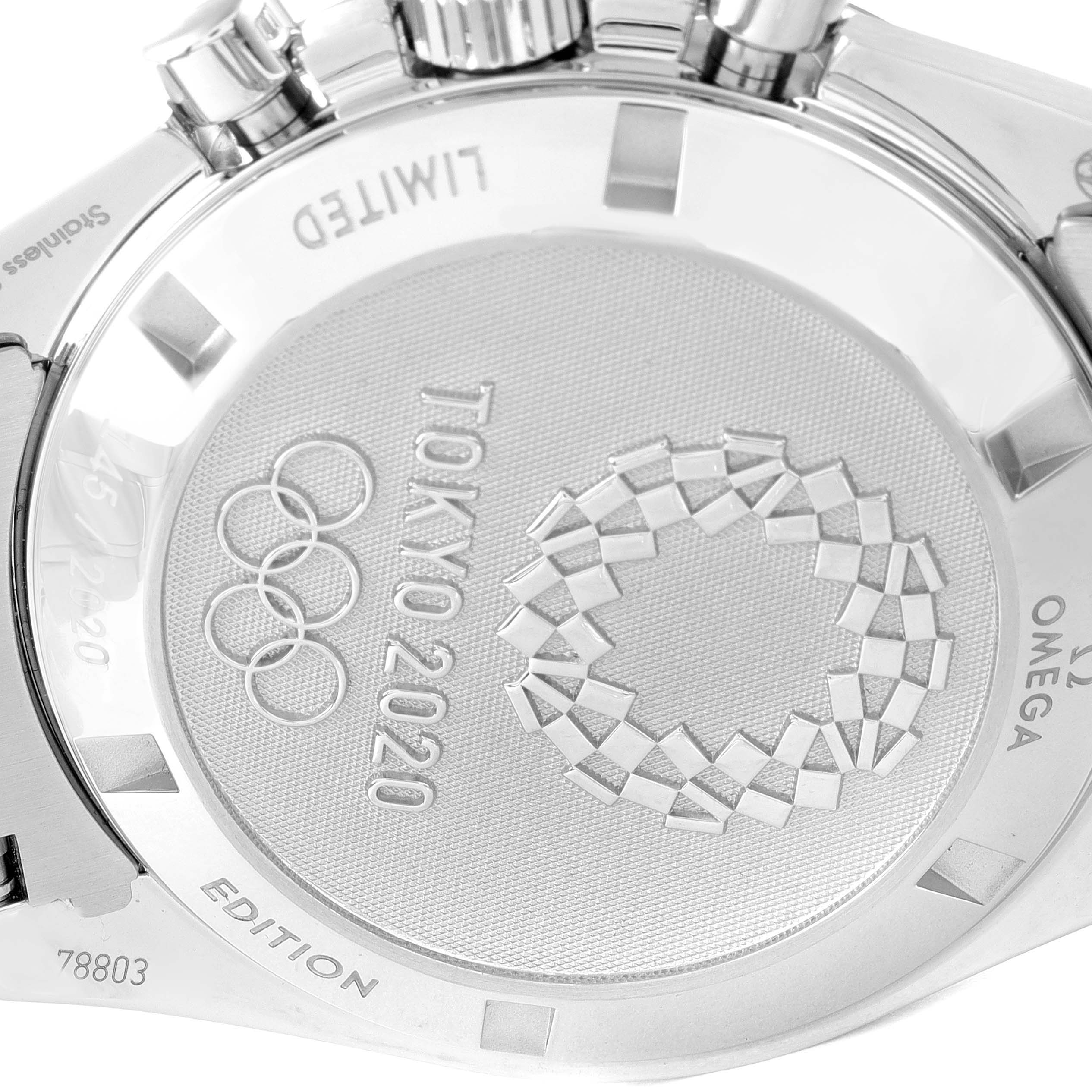 This image shows the back case of an Omega Speedmaster 522.30.42.30.03.001 Men's Stainless Steel Blue Dial 522.30.42.30.03.001 Men's Stainless Steel Blue Dial watch, displaying the Tokyo 2020 engraving and the Olympic rings.