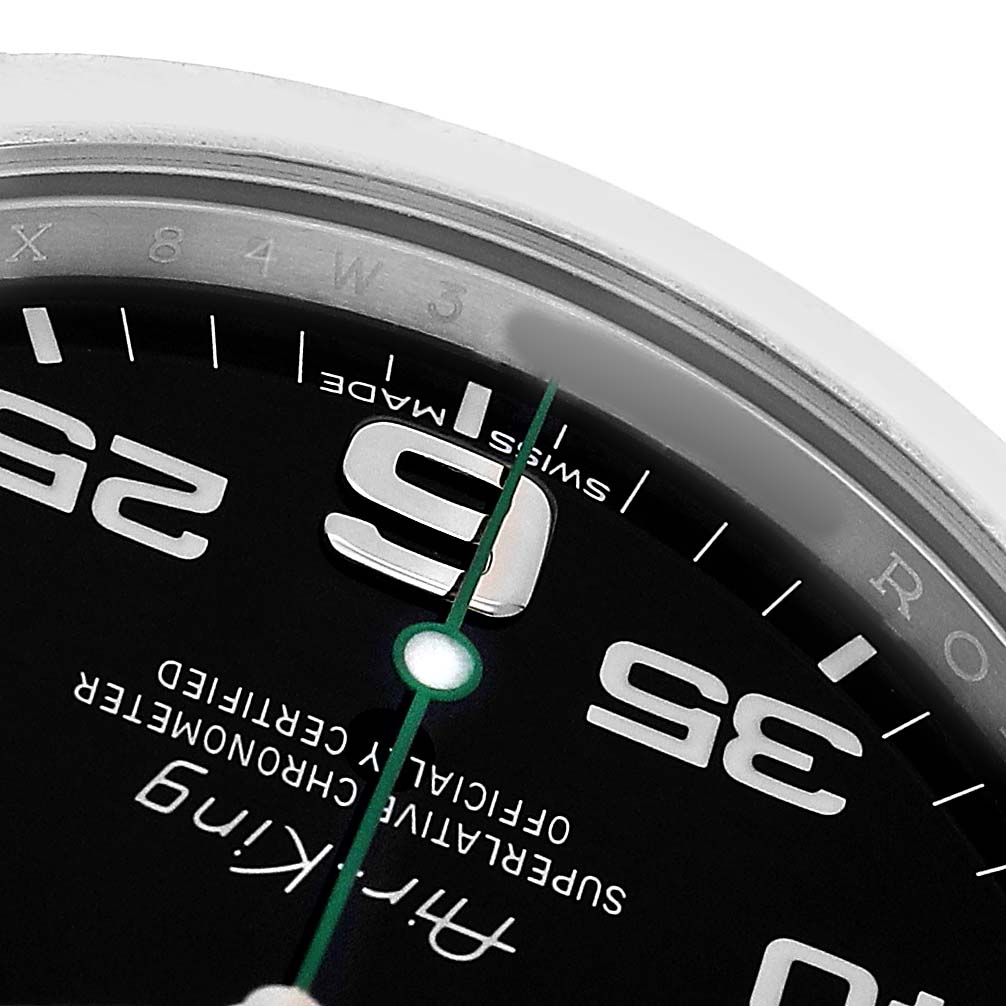 The image shows a close-up of the Rolex Air-King 116900 Men's Stainless Steel Black Dial watch face, focusing on the numbers "9" and parts of "35" with luminous markers and green second hand.