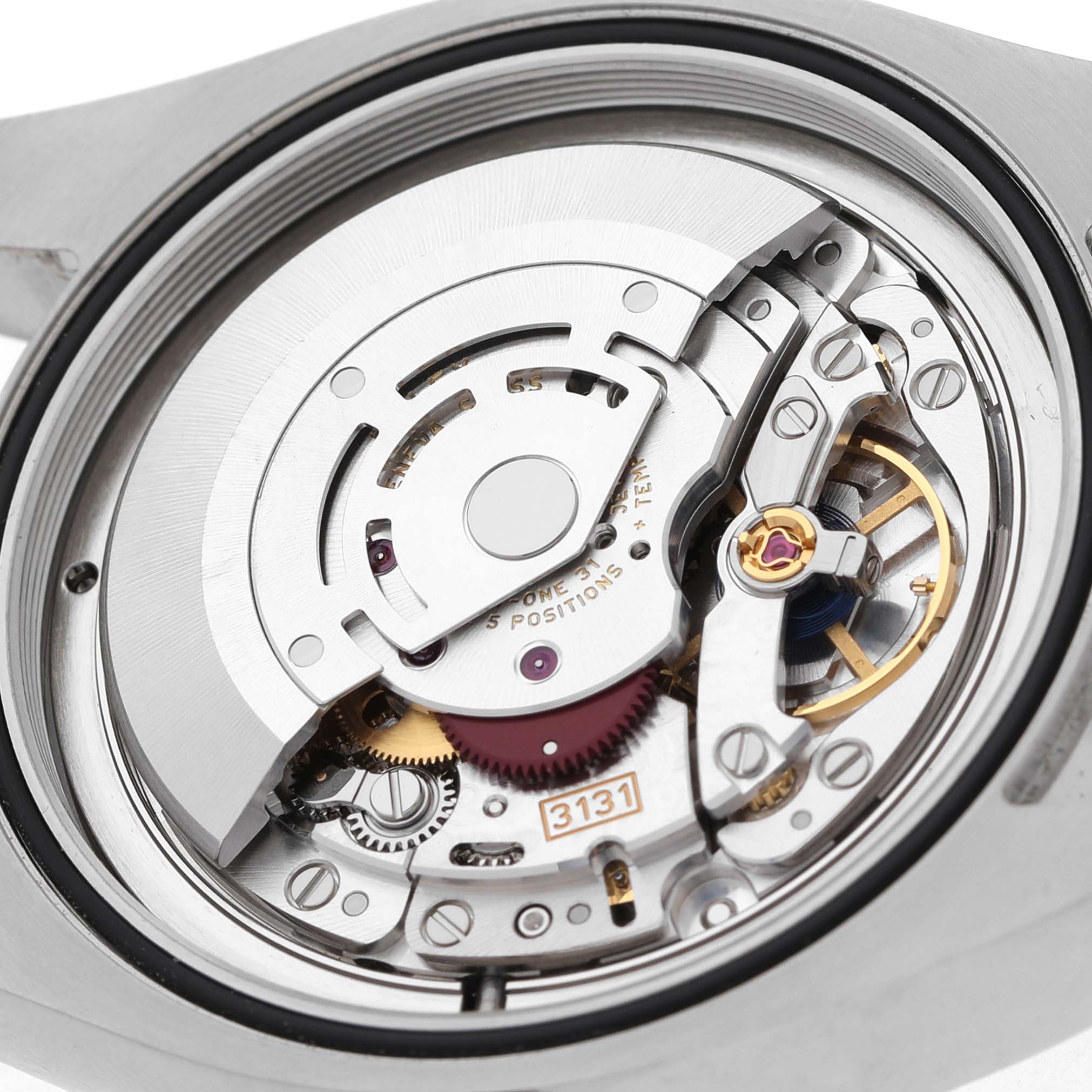 The image shows the movement of a Rolex Air-King 116900 Men's Stainless Steel Black Dial watch, highlighting the mechanical components and rotor.