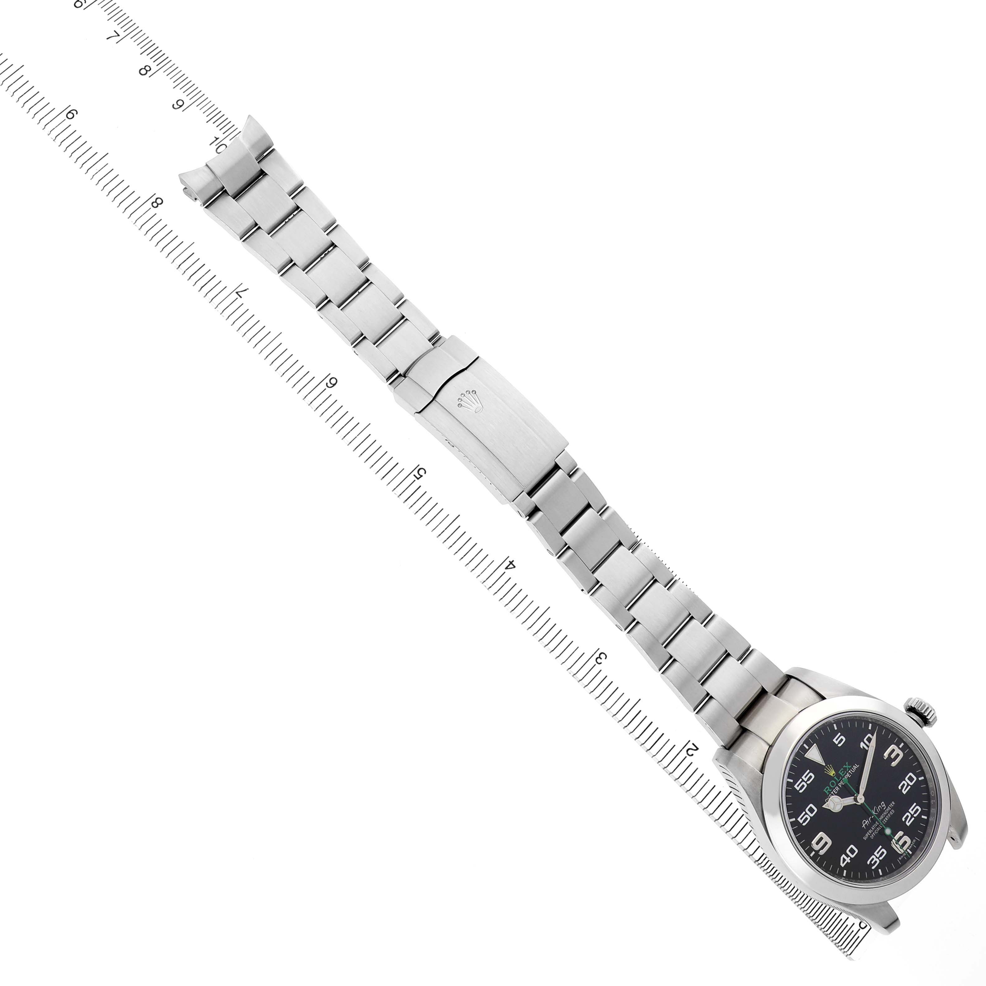 The Rolex Air-King 116900 Men's Stainless Steel Black Dial watch is shown from an overhead angle, displaying its full bracelet, clasp, and dial.