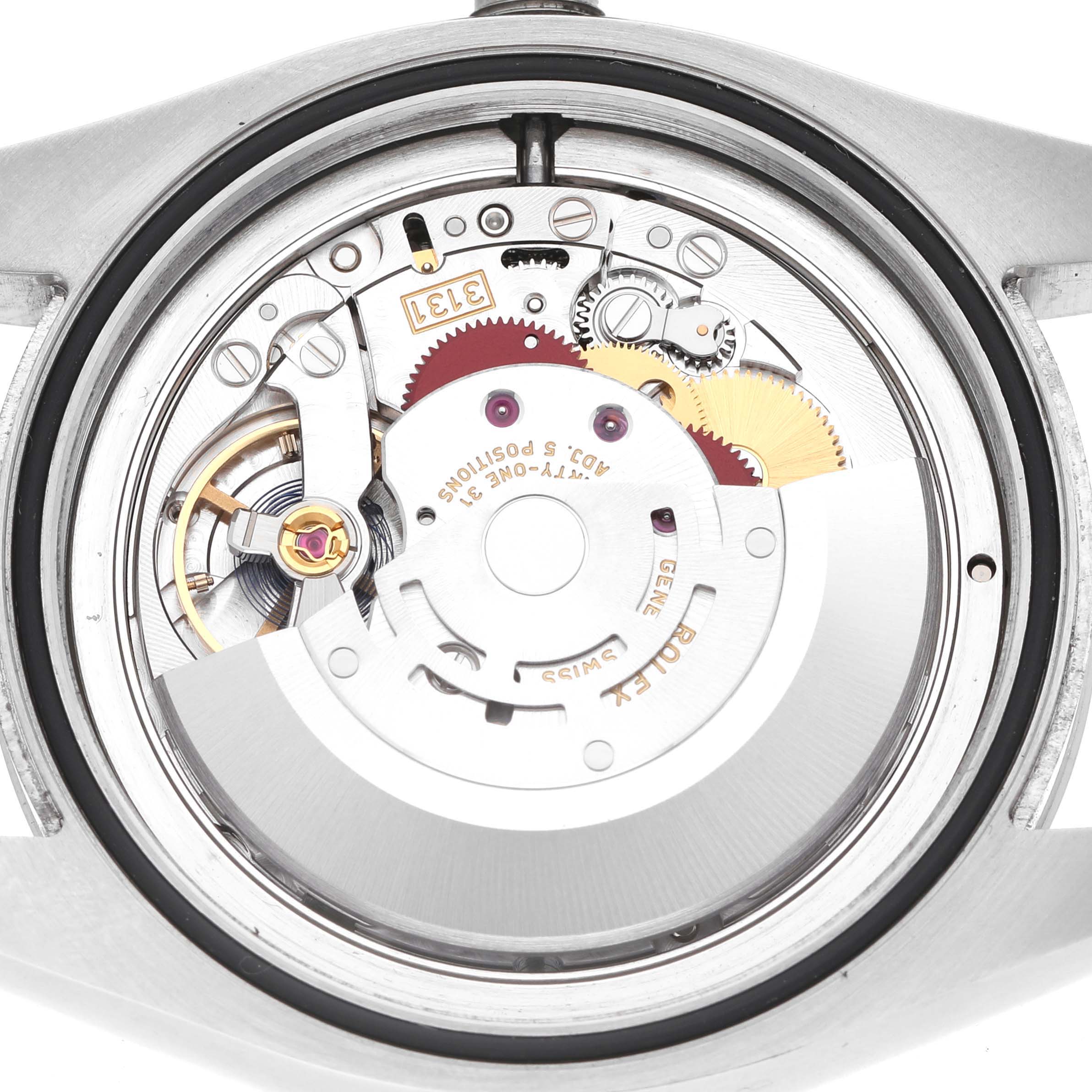 The image shows the movement mechanism from the back of a Rolex Air-King 116900 Men's Stainless Steel Black Dial watch.