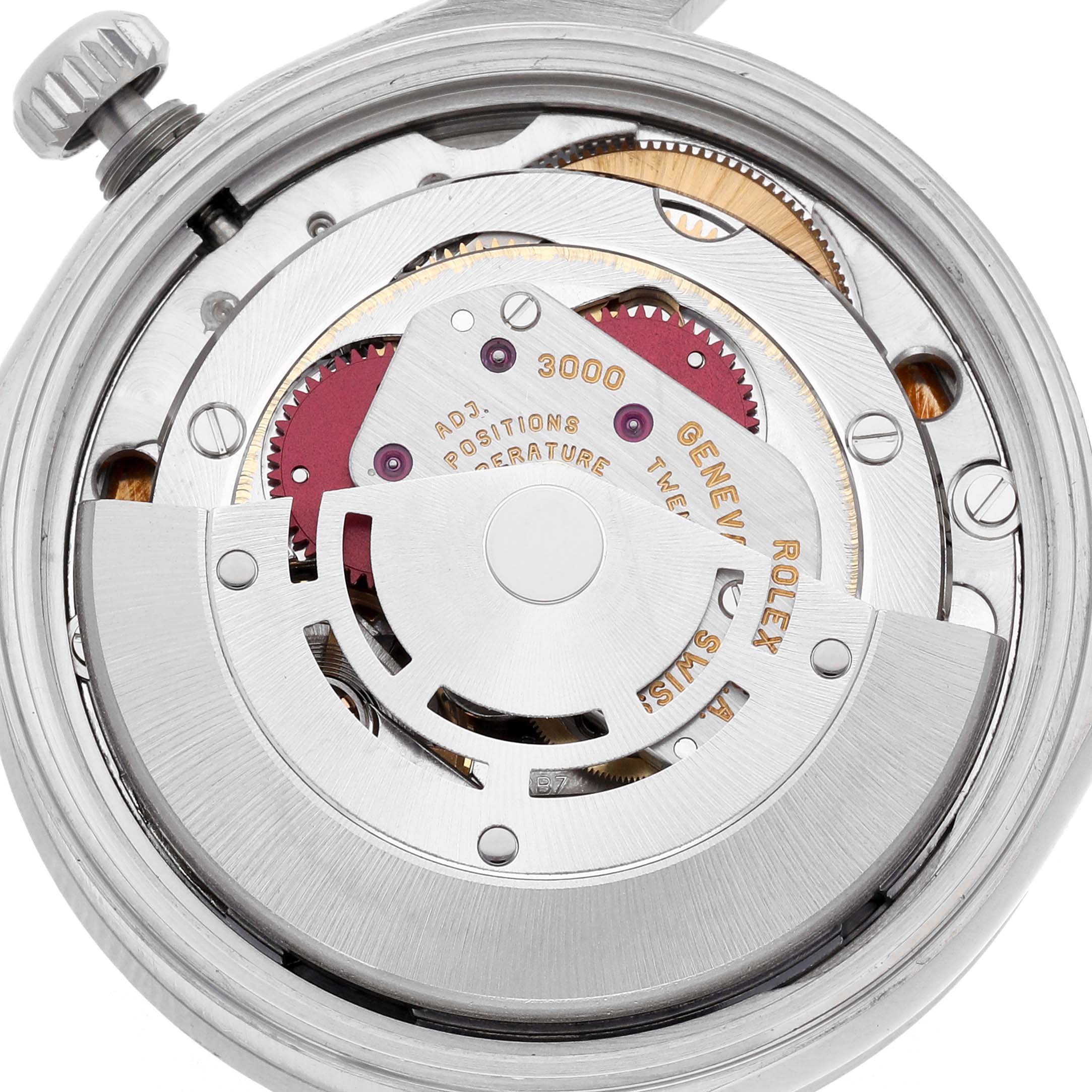 The image shows the movement of a Rolex Air-King 14010 Men's Stainless Steel Blue Dial 14010 Men's Stainless Steel Blue Dial watch, highlighting the intricate mechanism from the top view.